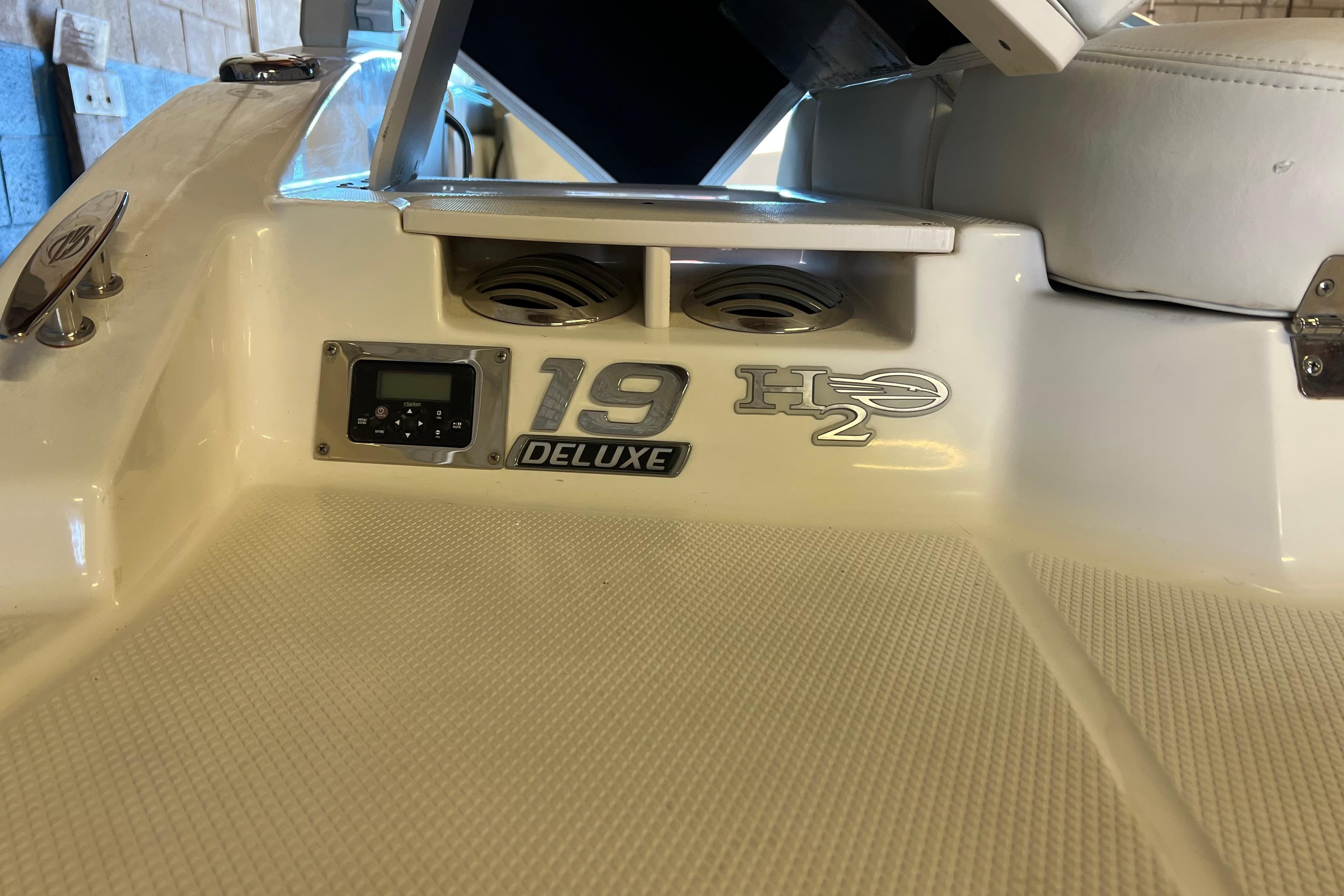 2017 Chaparral 19 H2O Sport boat interior, featuring deluxe model details and control panel.