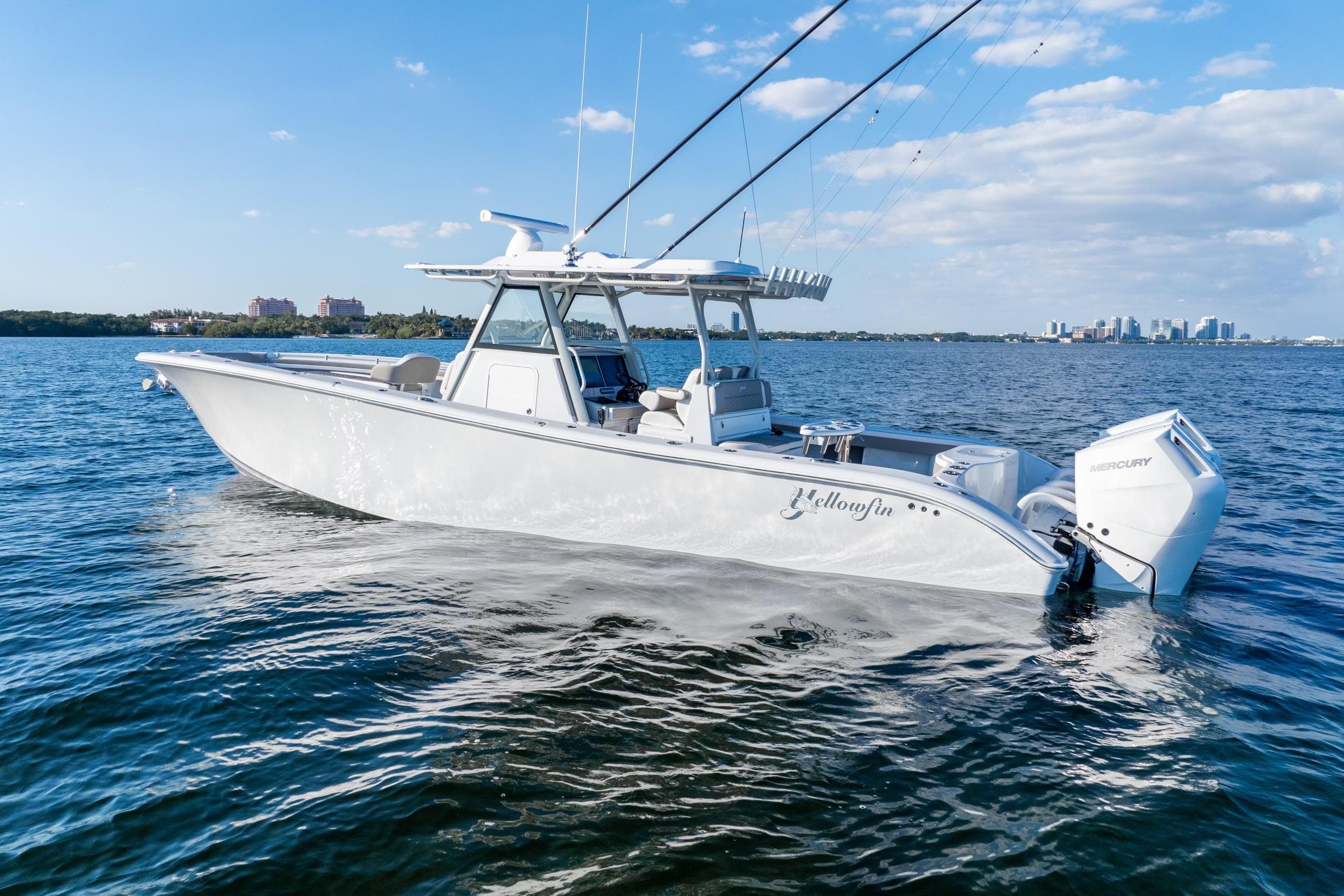 2024 Yellowfin 39 boat on open water, clear sky, city skyline in background.