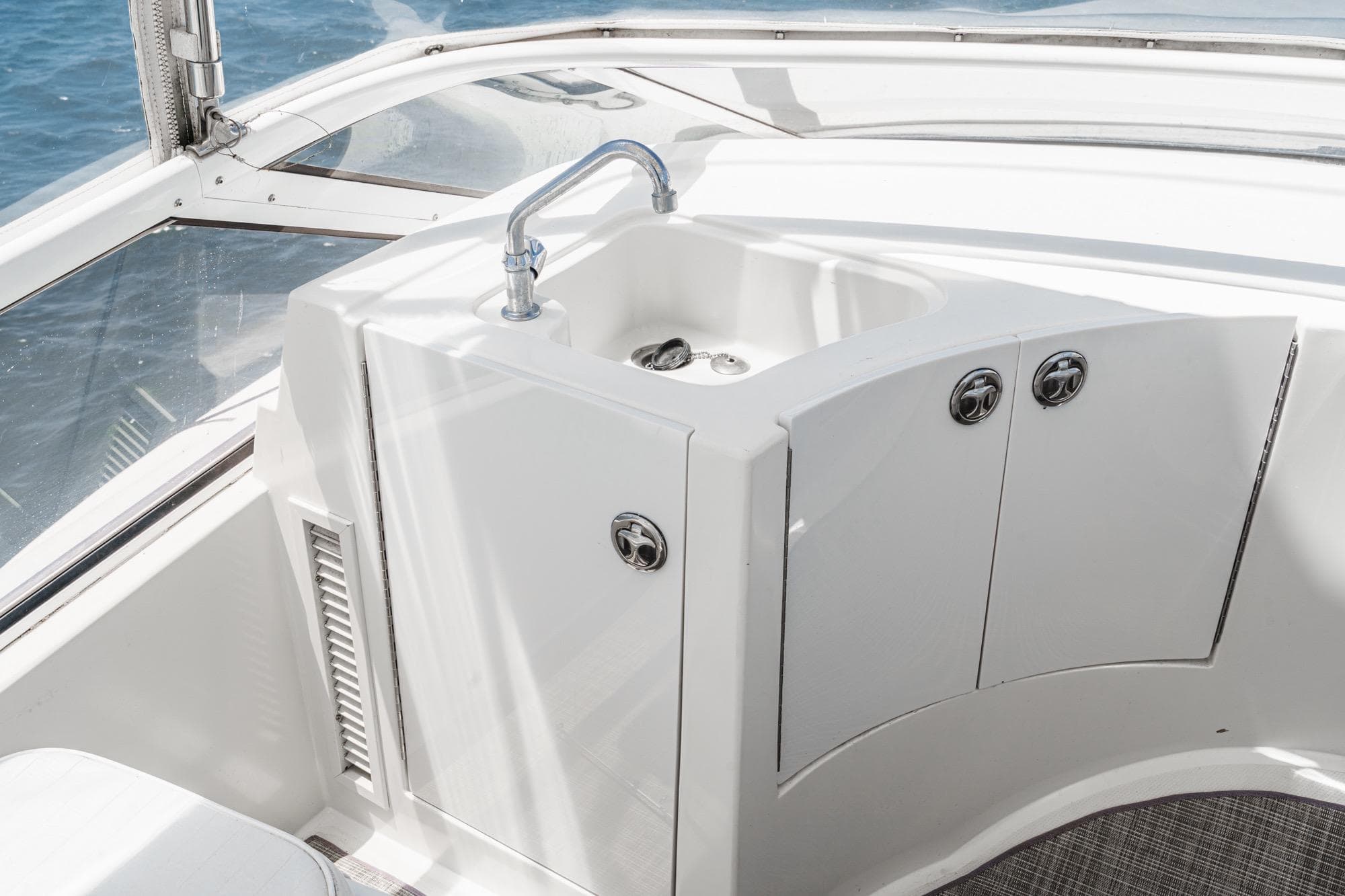2005 Carver 38 Super Sport yacht sink and storage area on deck.