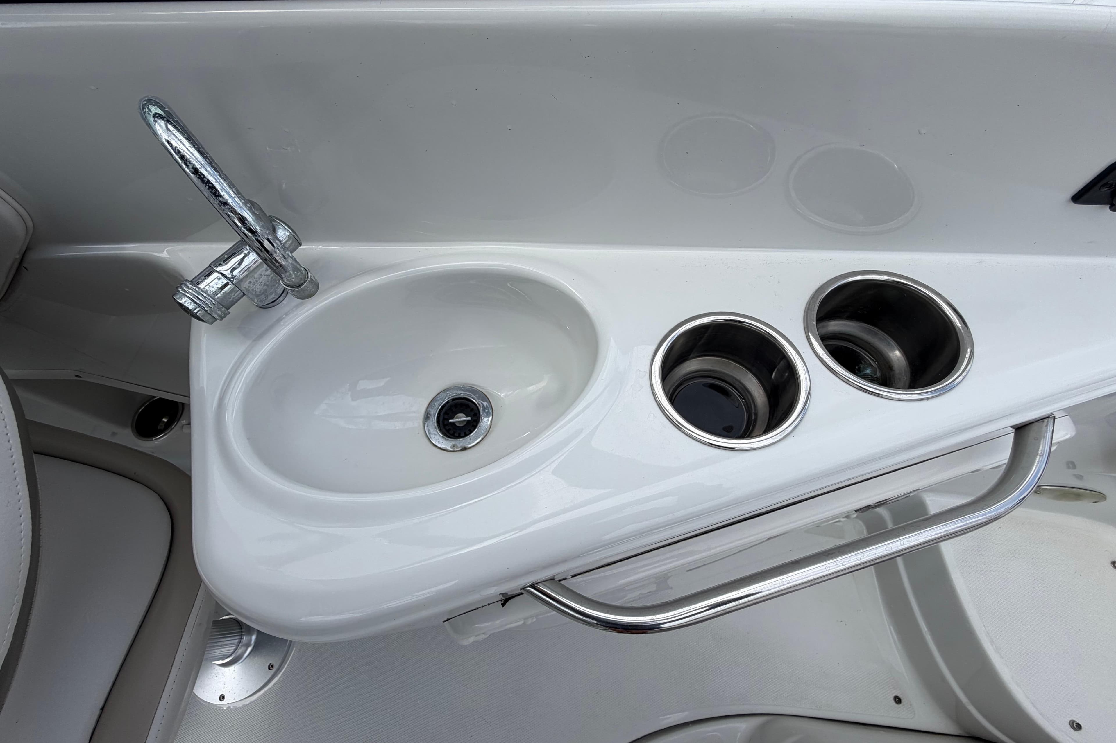 Crownline 236 SC 2012 boat sink with faucet and cup holders.