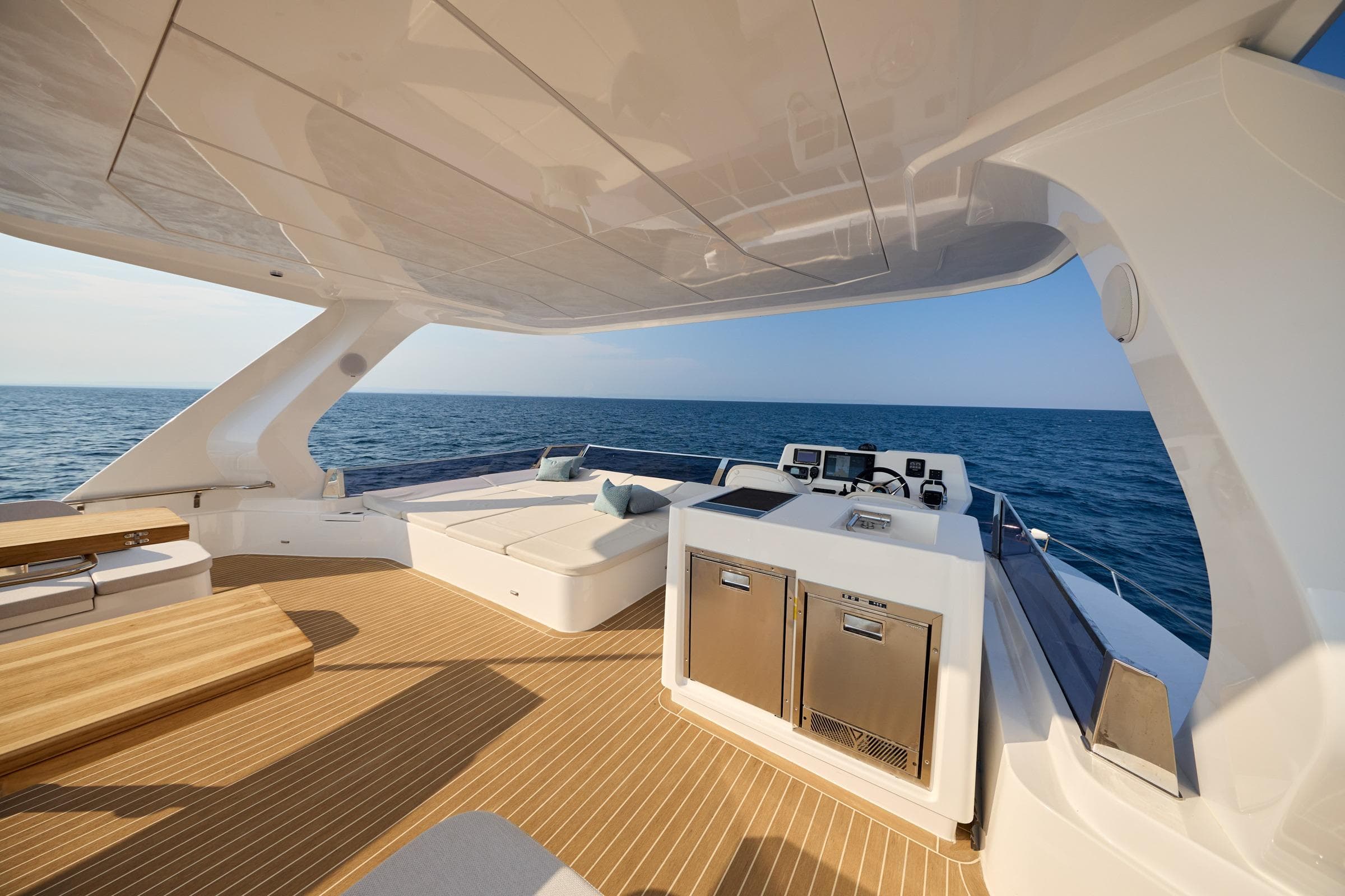 Luxurious 2025 Omaya 50 Power Catamaran with spacious deck and modern amenities, cruising on open sea.