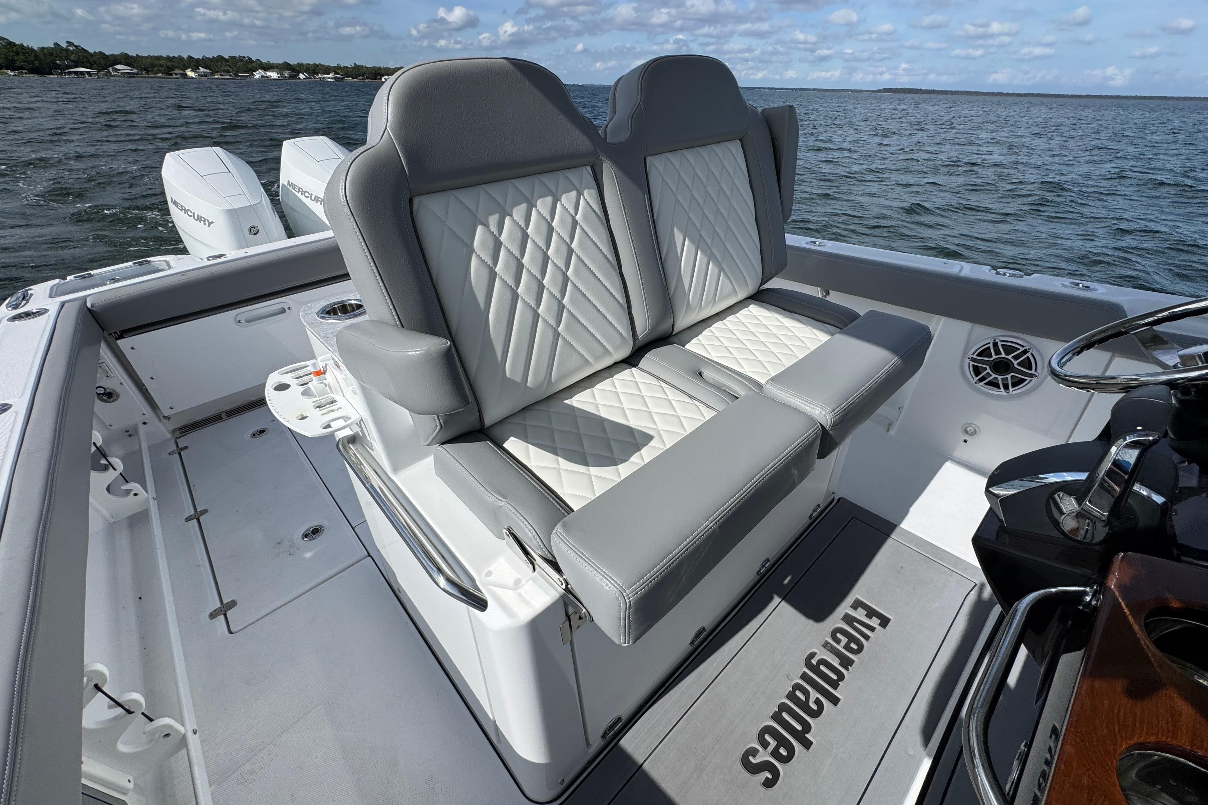 2025 Everglades 315 Center Console boat with luxurious seating and dual Mercury engines.