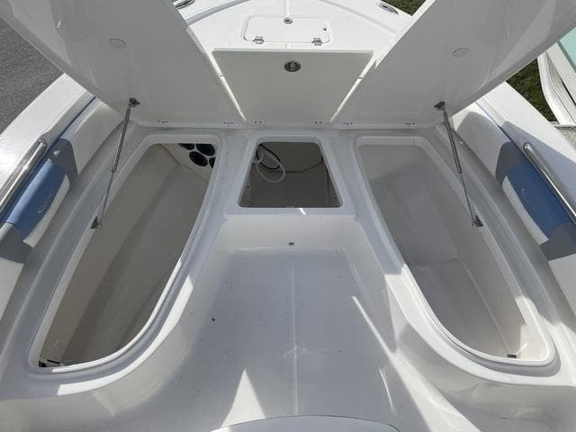 2024 Robalo 206 Cayman boat storage compartments open.