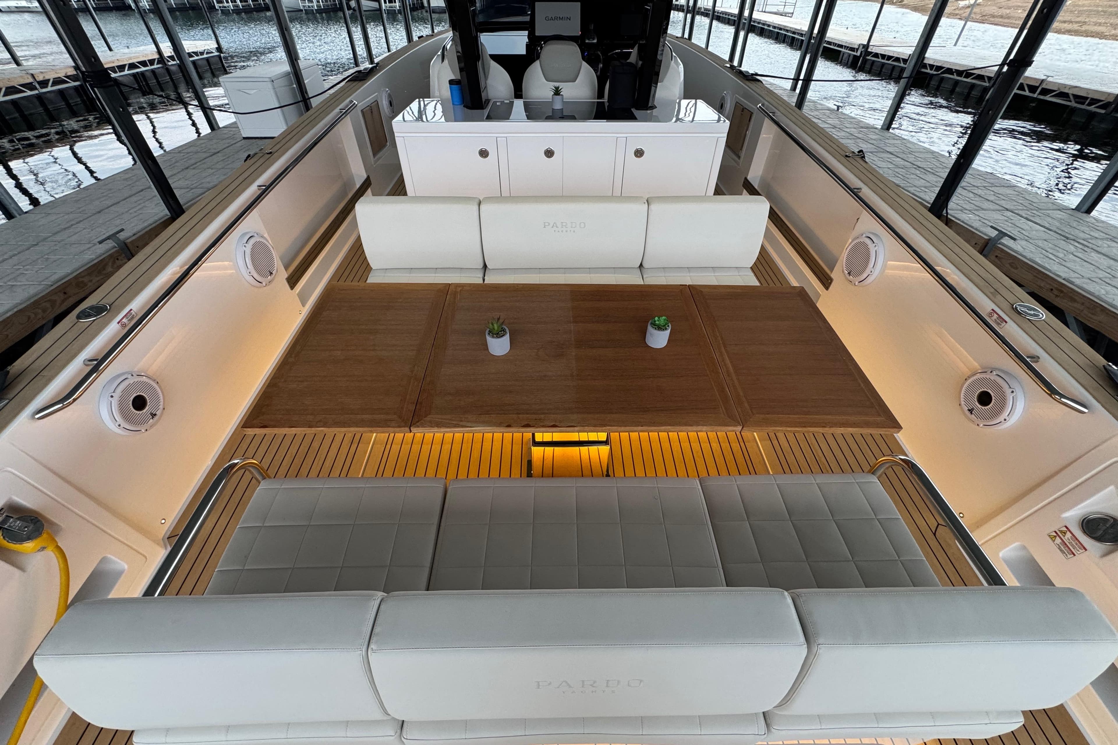 Luxurious 2025 Pardo Yachts P38 interior with elegant seating and wooden table.