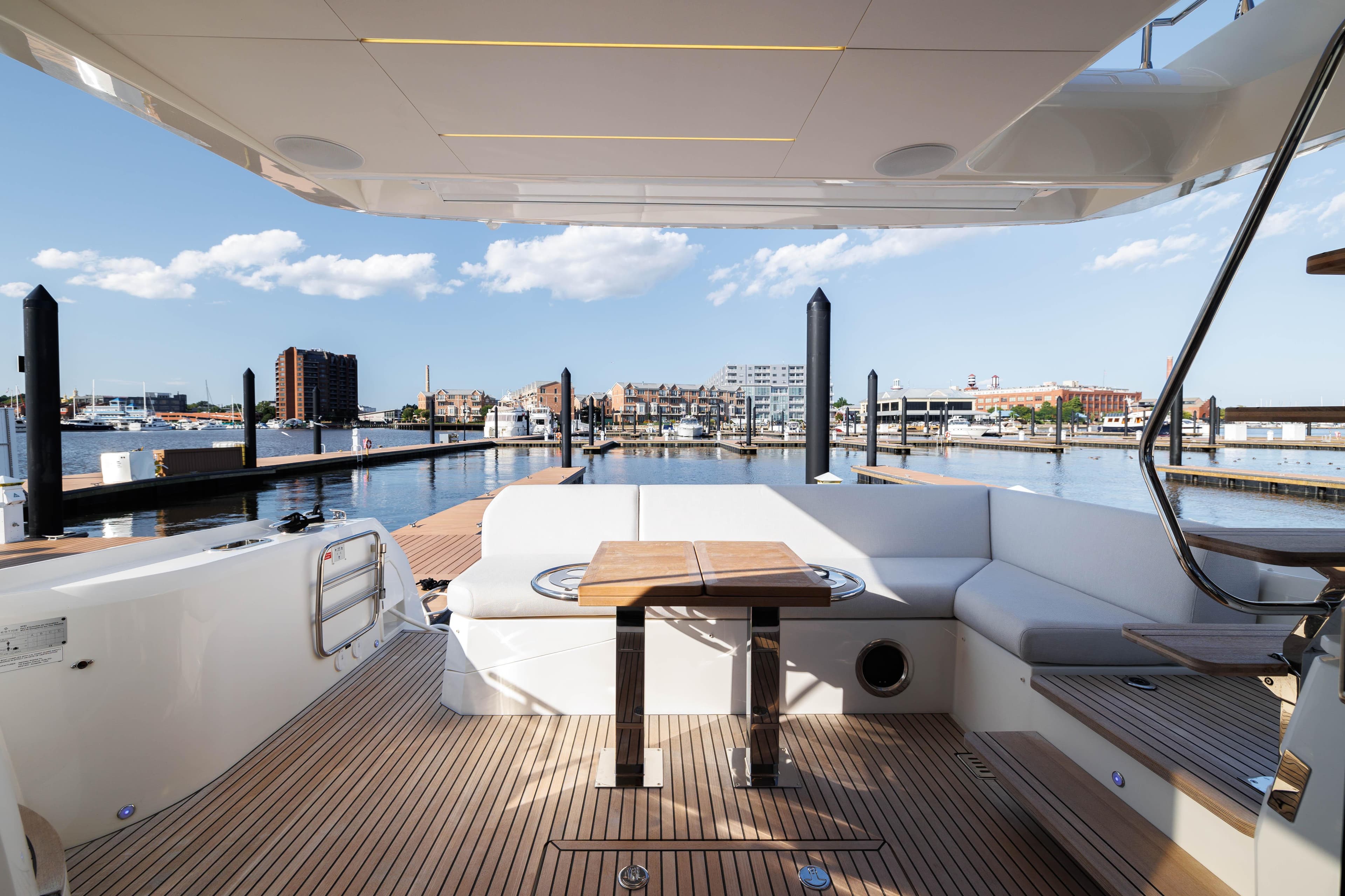 2024 Prestige 520 yacht with spacious deck and waterfront view.