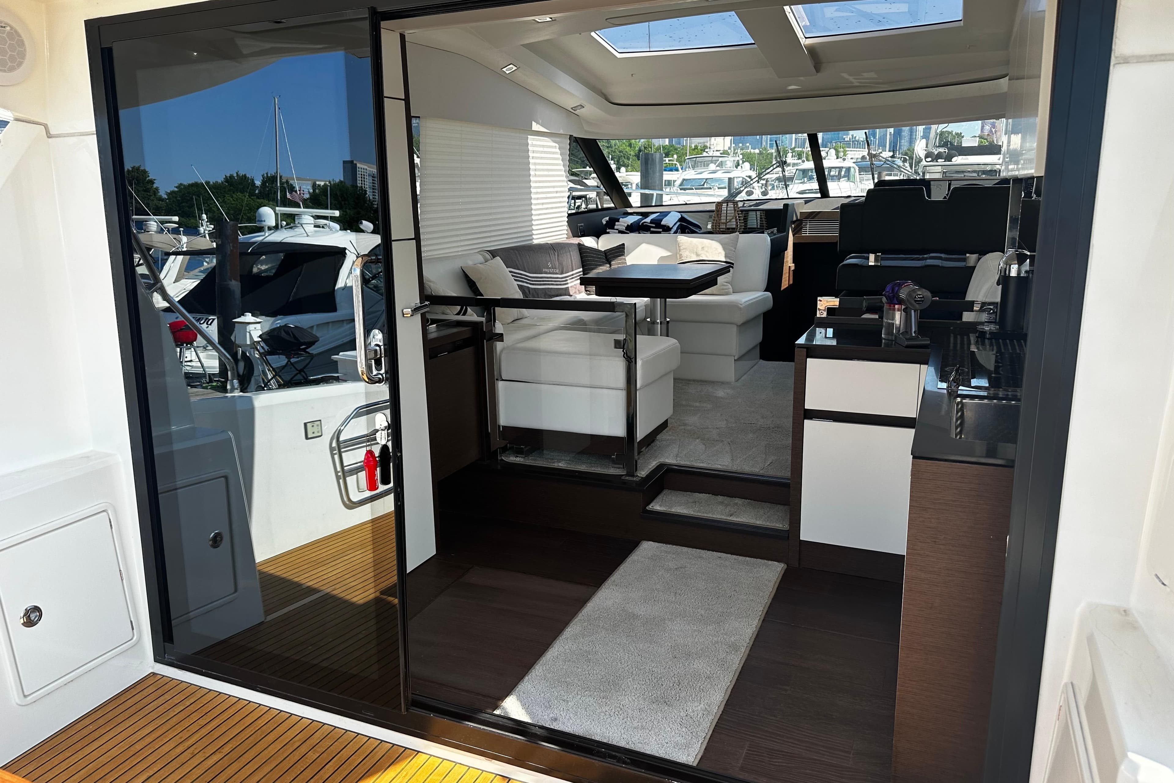 Luxurious interior of a 2018 Prestige 460 yacht with modern furnishings and sleek design.