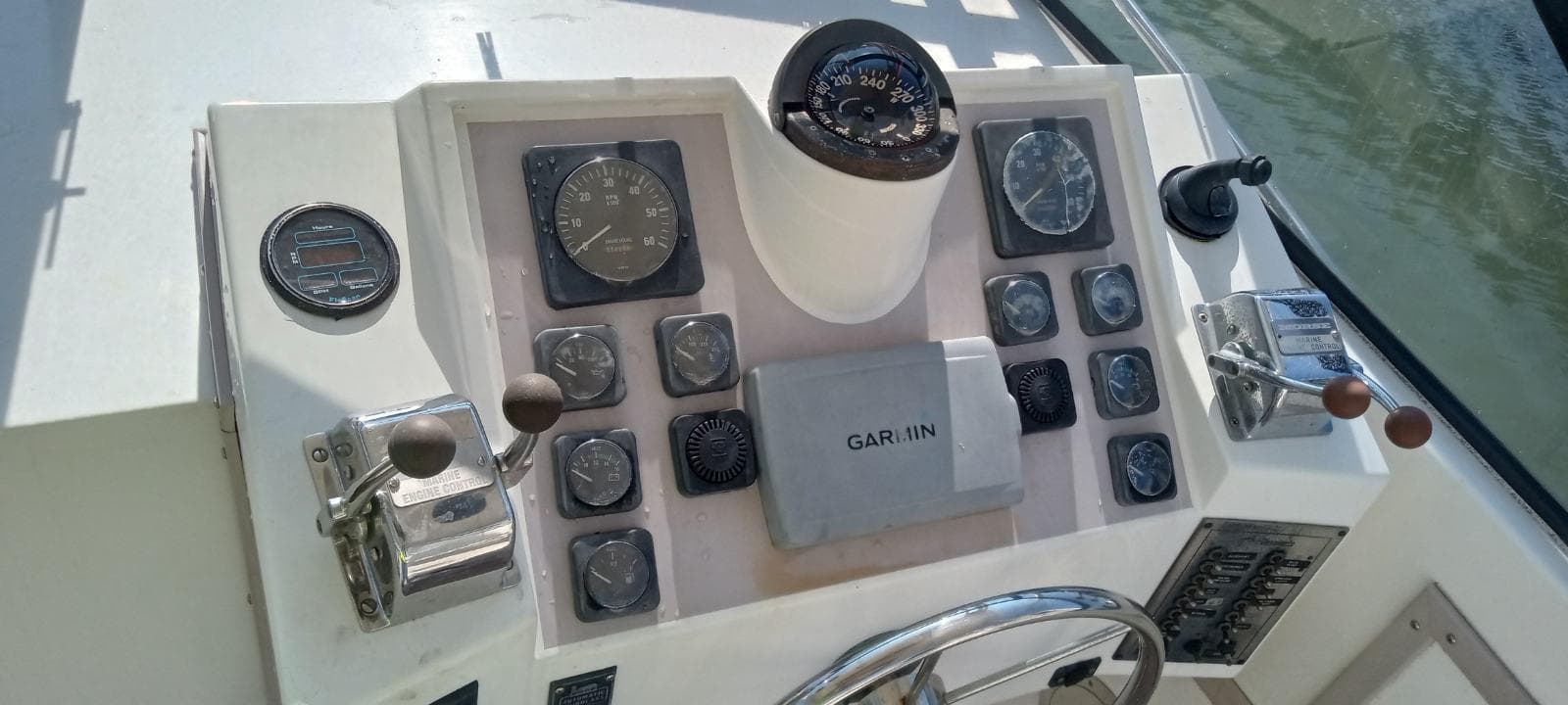 Control panel of a 1994 Albemarle 27sf boat with Garmin navigation system.