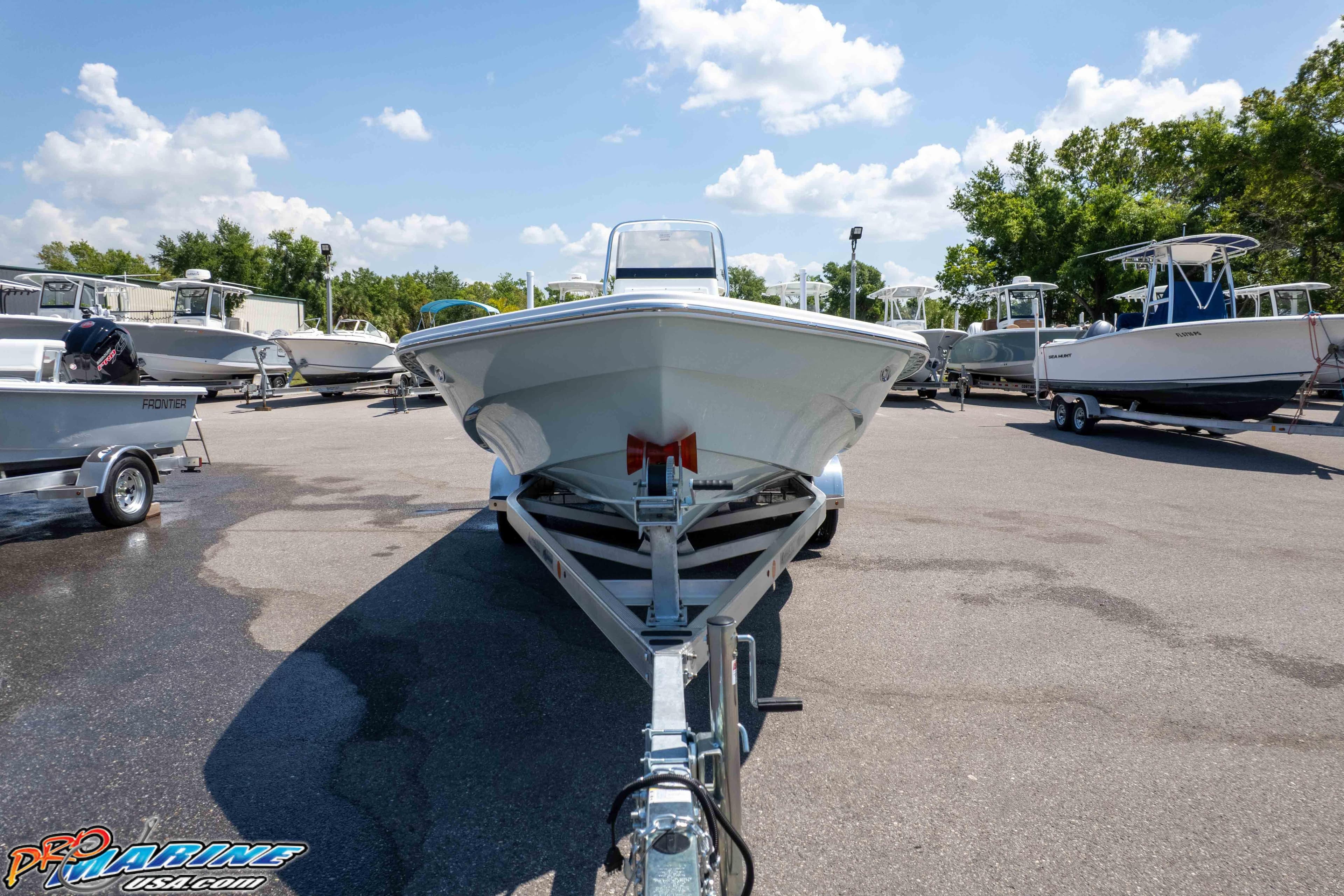 Frontier 2104 boat on trailer in sunny outdoor showroom, 2025 model.