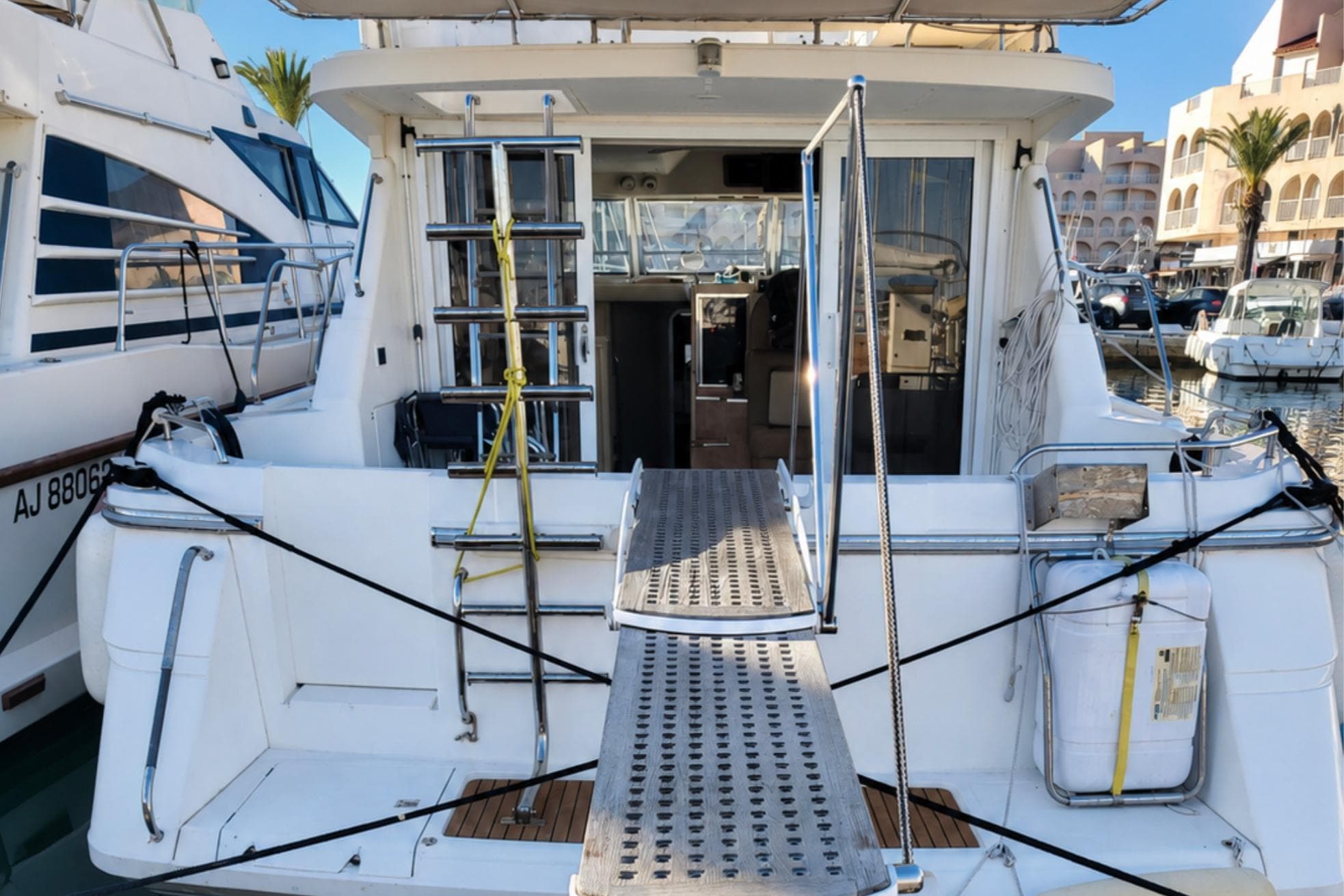 1993 Princess 410 yacht docked at marina, featuring rear deck and boarding ladder.