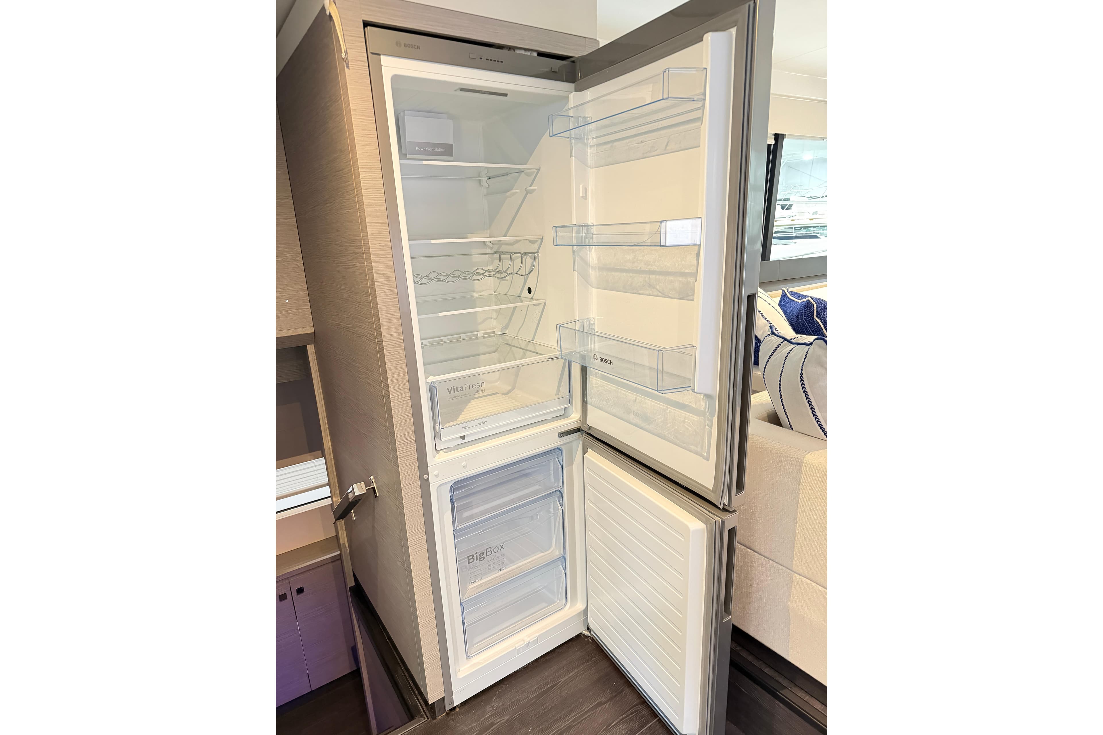 Modern refrigerator inside 2024 Fountaine Pajot MY5 yacht, featuring spacious interior and sleek design.