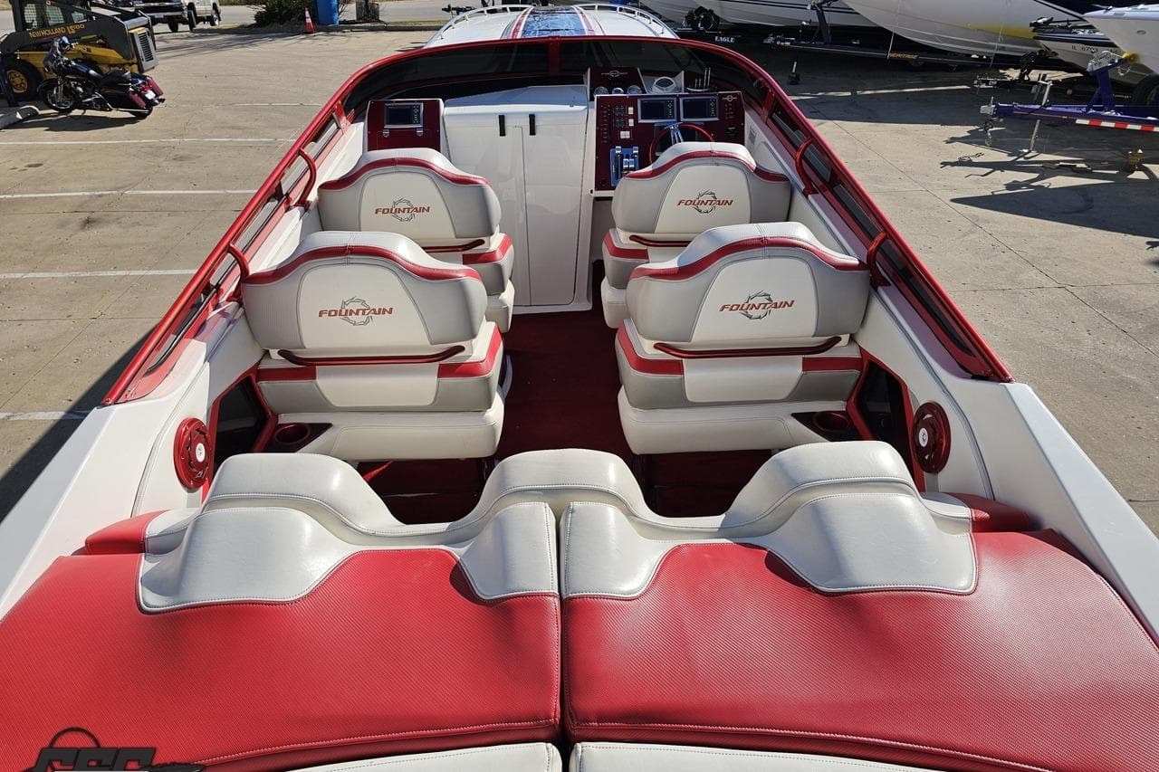 2009 Fountain 47 Lightning boat interior with red and white seating, showcasing luxury design.