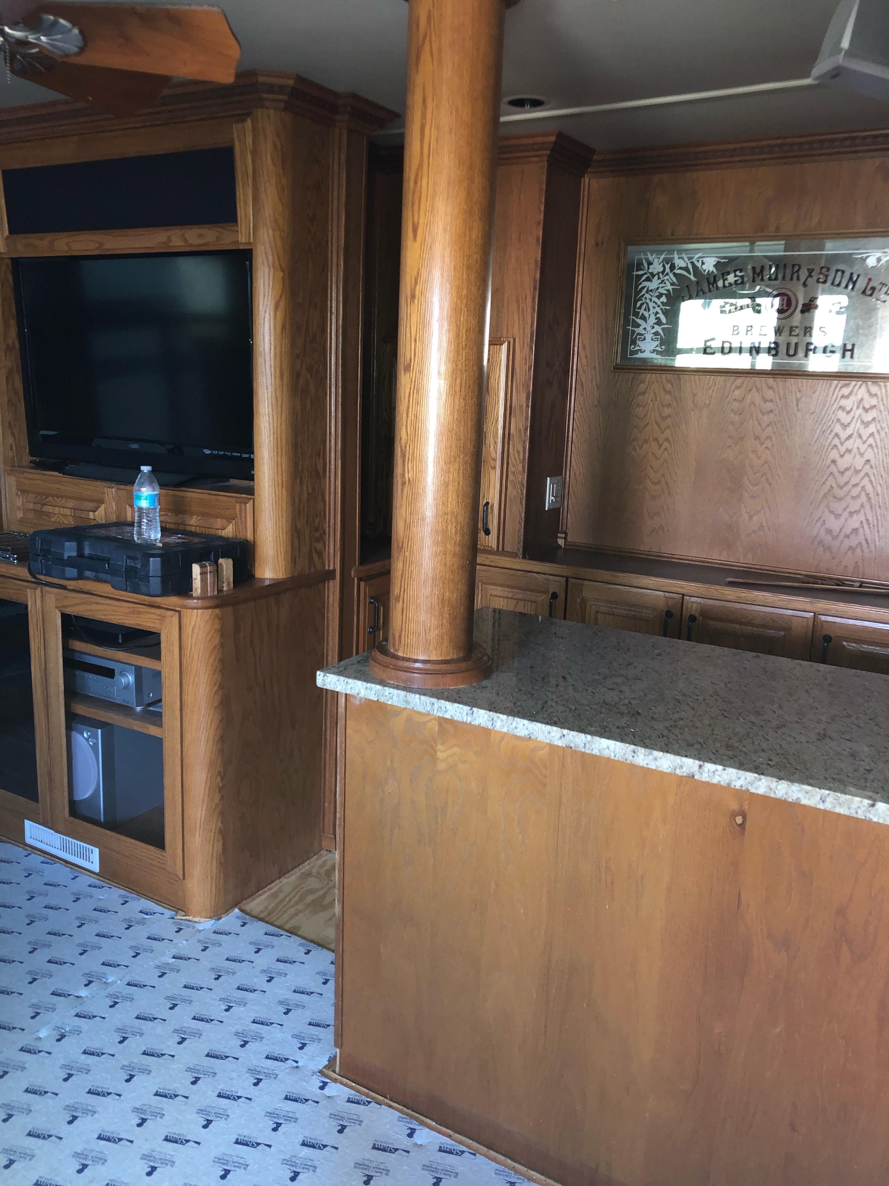 Interior of 2004 Sumerset Wind Walker with wood cabinetry and granite countertop.