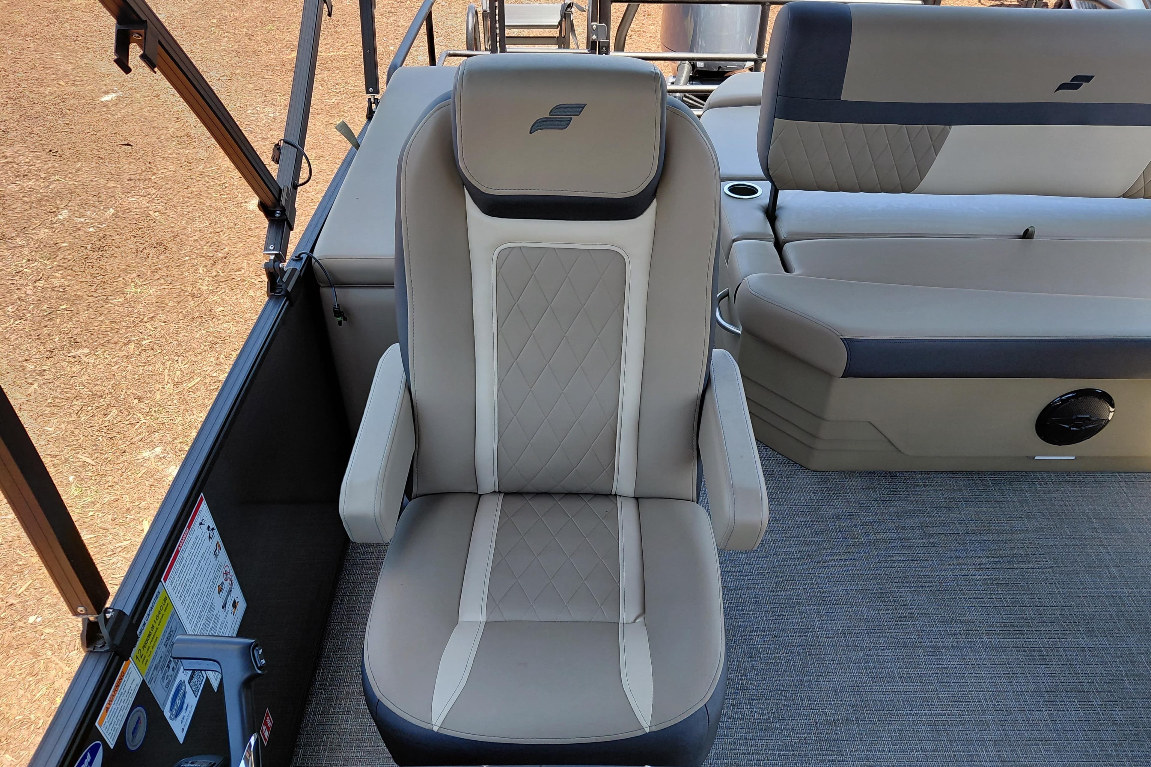 Captain's chair on 2026 Starcraft EXS 3 Q DH boat, featuring elegant upholstery and design.