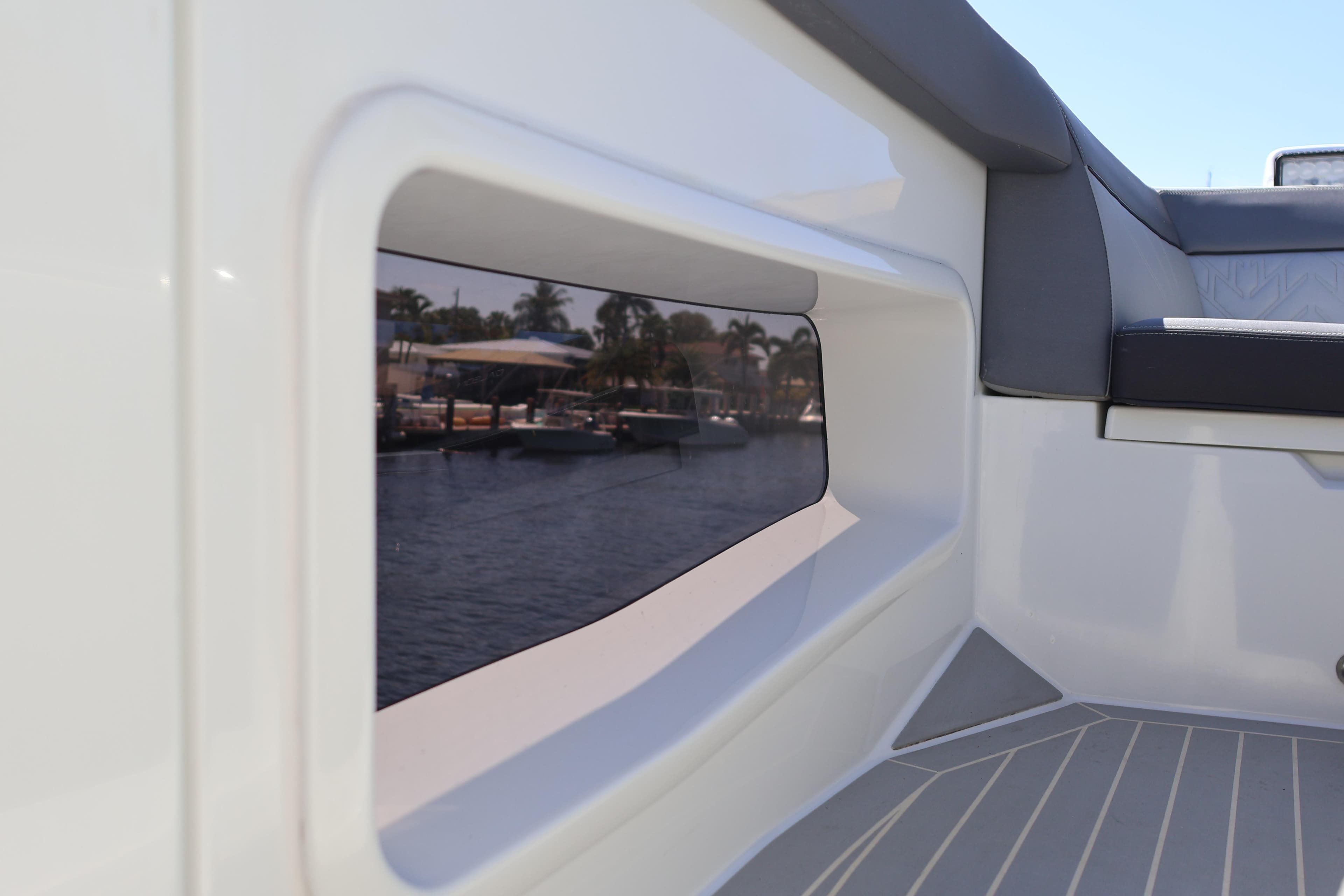 2024 Galeon 325 GTO interior view with sleek seating and window reflection.