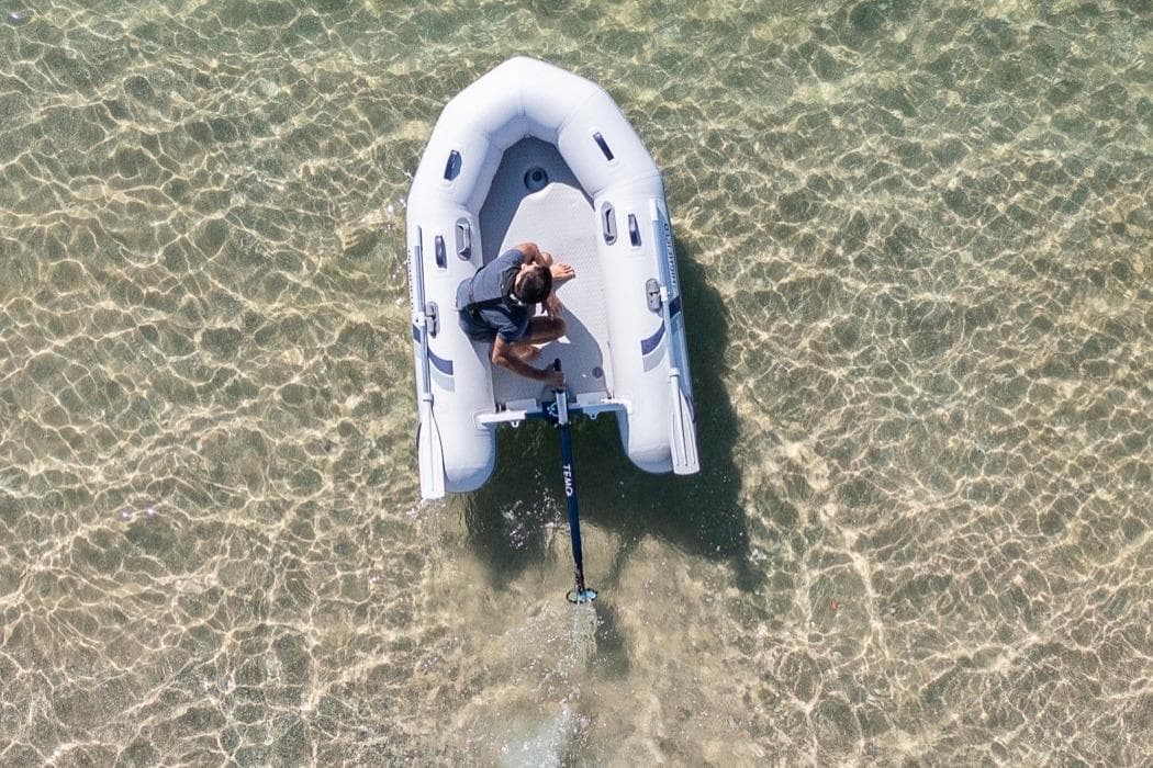 Aerial view of Highfield Roll-Up 250 KAM boat in clear water.