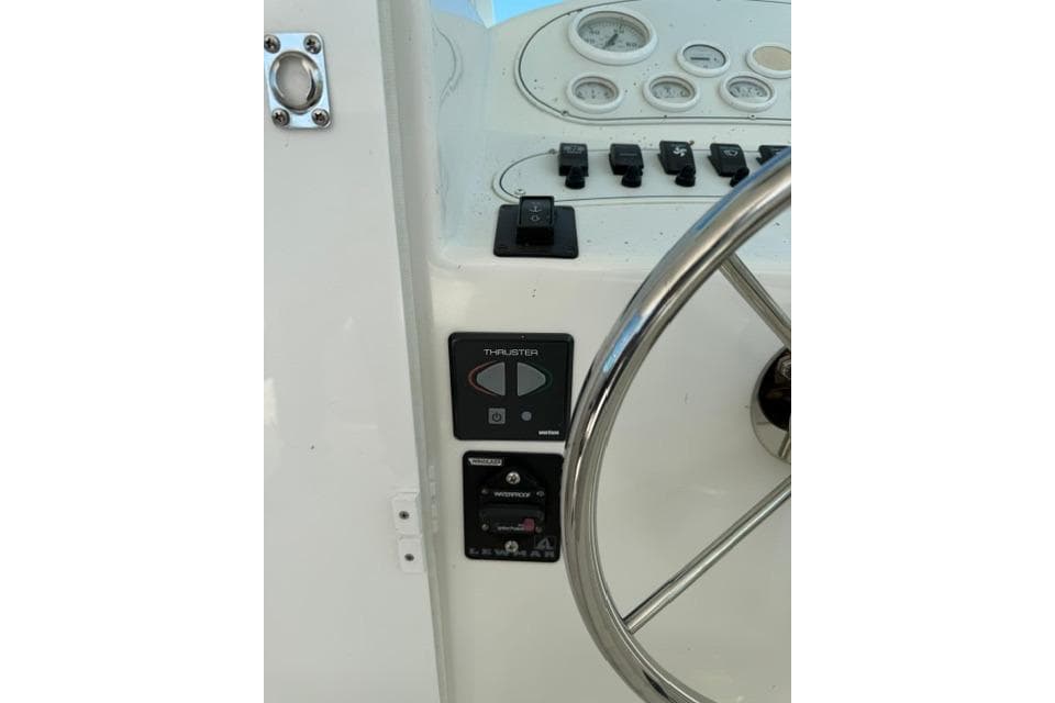 2006 Baha Cruisers 300 GLE helm with steering wheel and control panel.