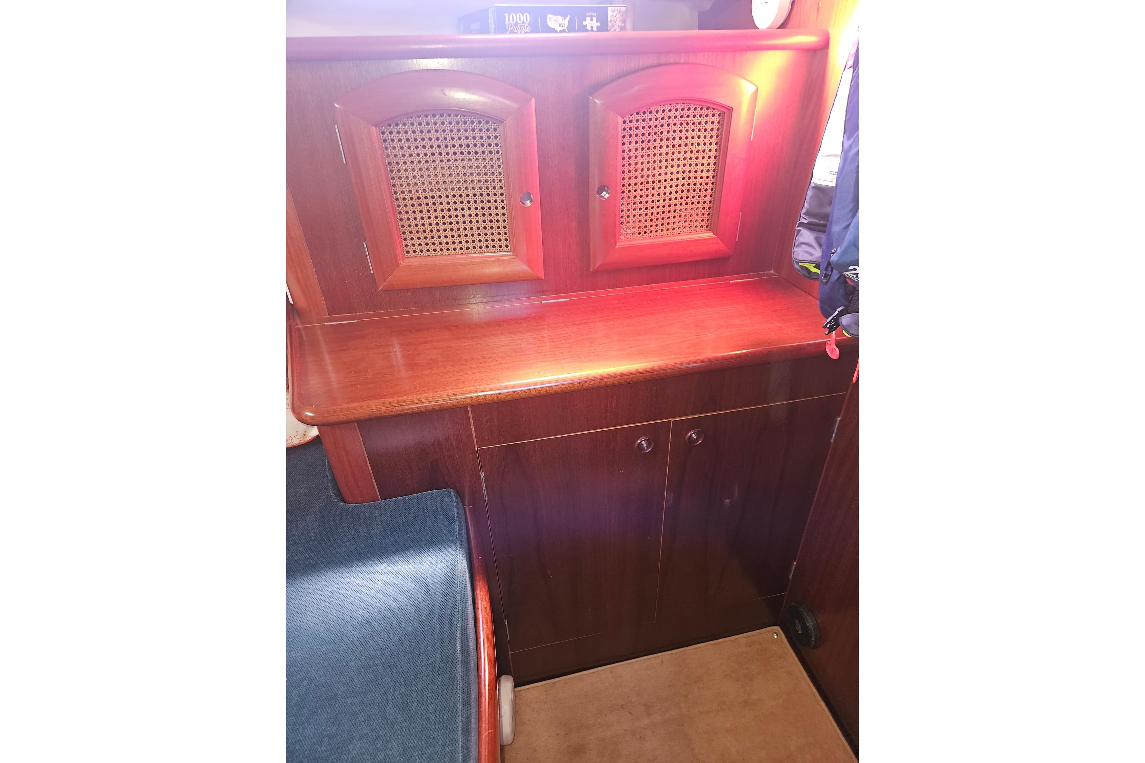 Interior of 1998 Beneteau 381 sailboat with wooden cabinetry and seating.