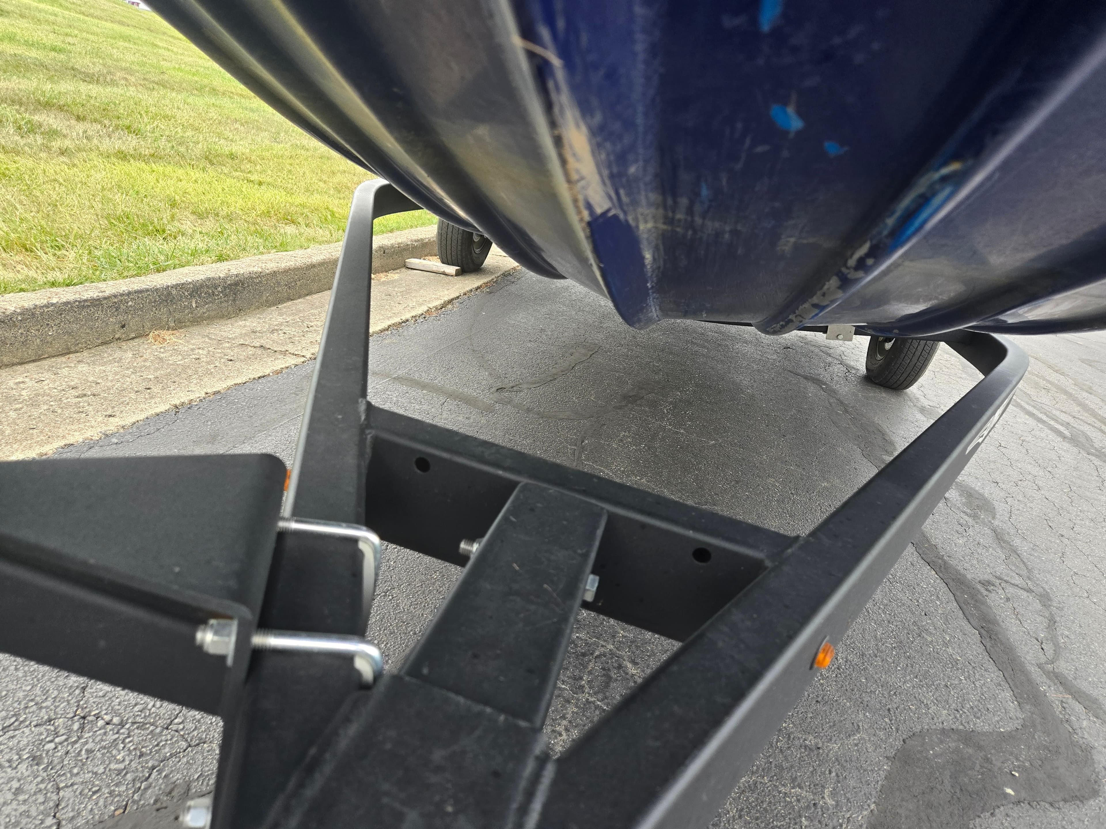 2021 Lowe Stinger 188 boat on trailer, close-up view of hull and frame.