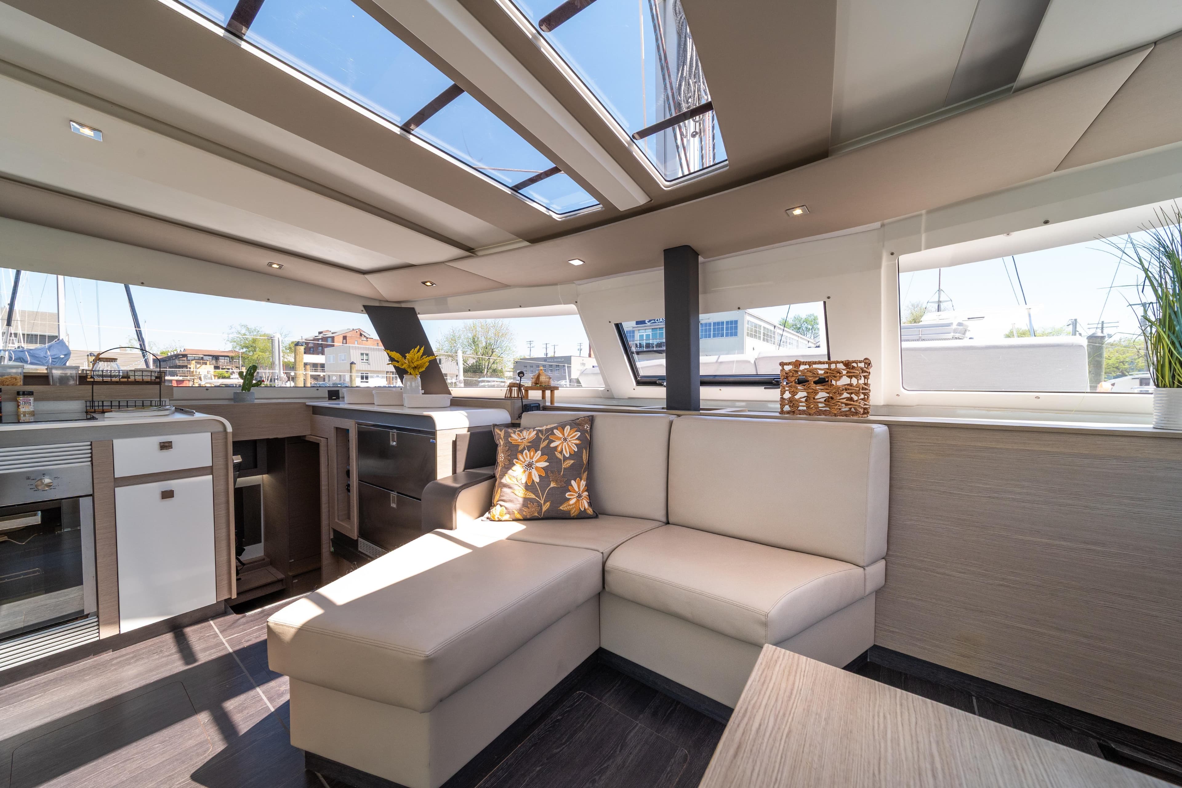Luxurious interior of 2022 Fountaine Pajot Aura 51 Catamaran with modern furnishings and ample natural light.