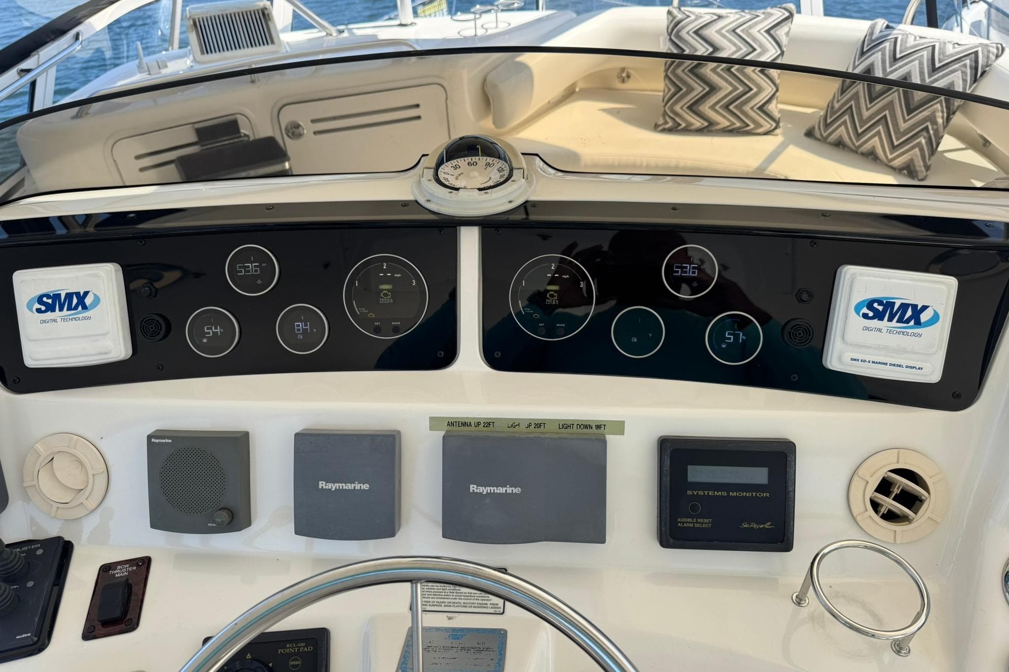 2003 Sea Ray 480 Sedan Bridge dashboard with navigation and control systems, featuring Raymarine technology.