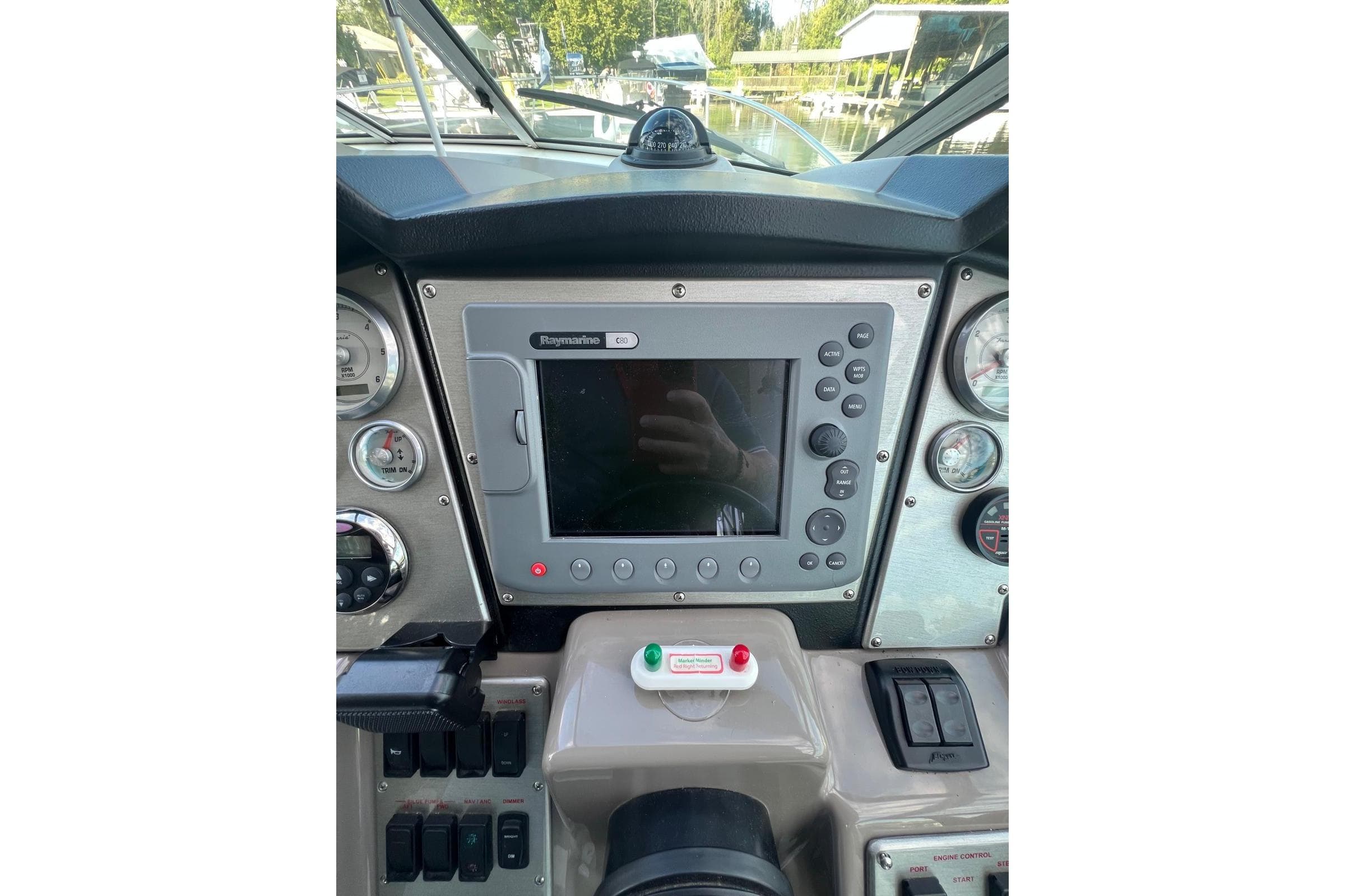 2008 Cruisers Yachts 330 Express dashboard with Raymarine navigation system and gauges.