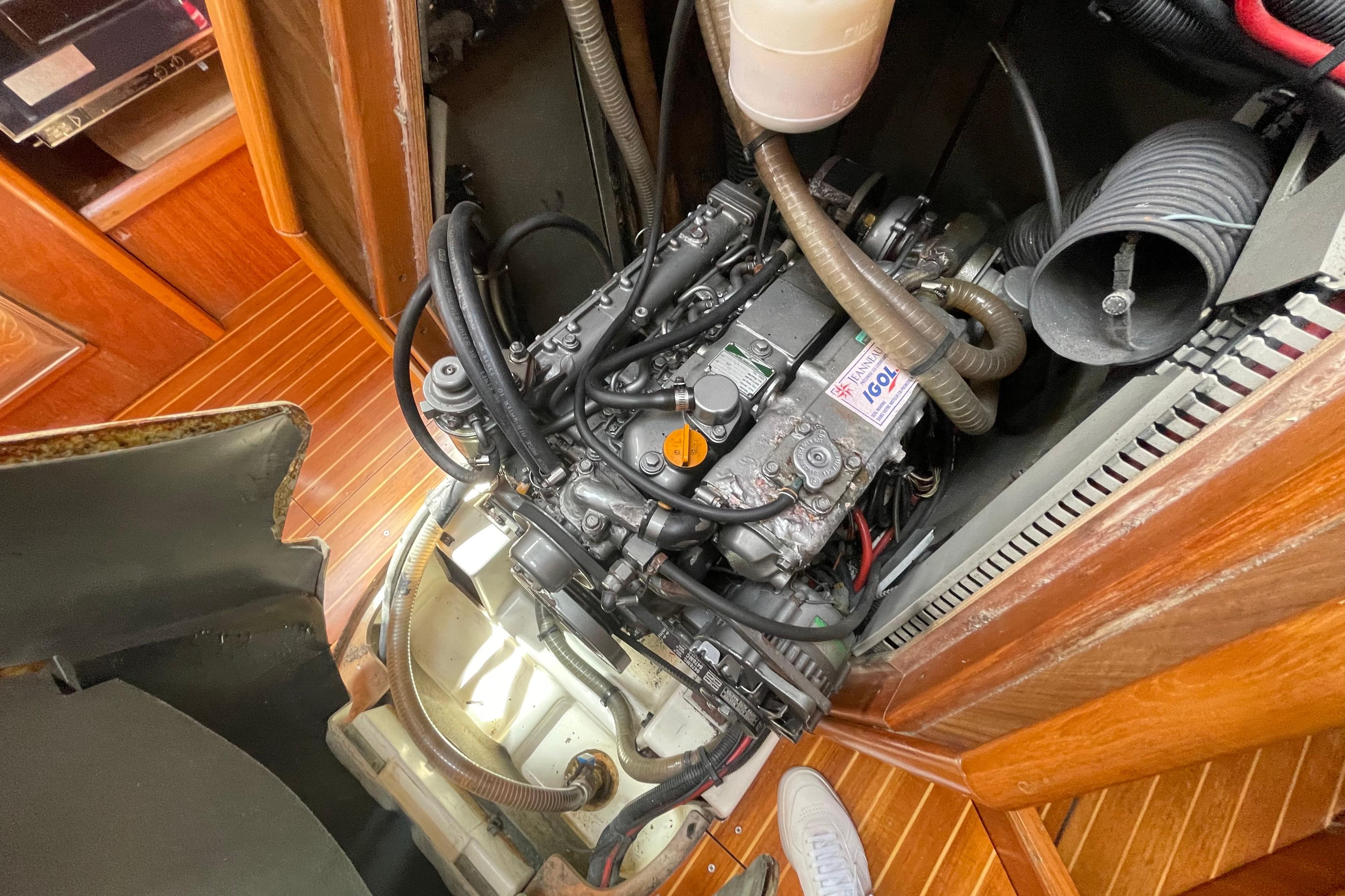 Engine compartment of a 2003 Jeanneau Sun Odyssey 43 sailboat, showcasing detailed mechanics.