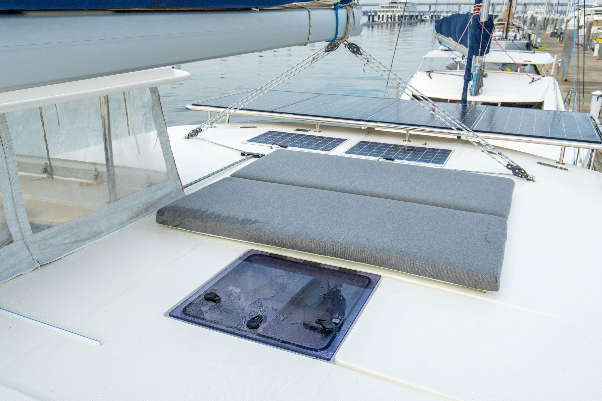 2016 Leopard 48 yacht deck with solar panels and cushioned seating.