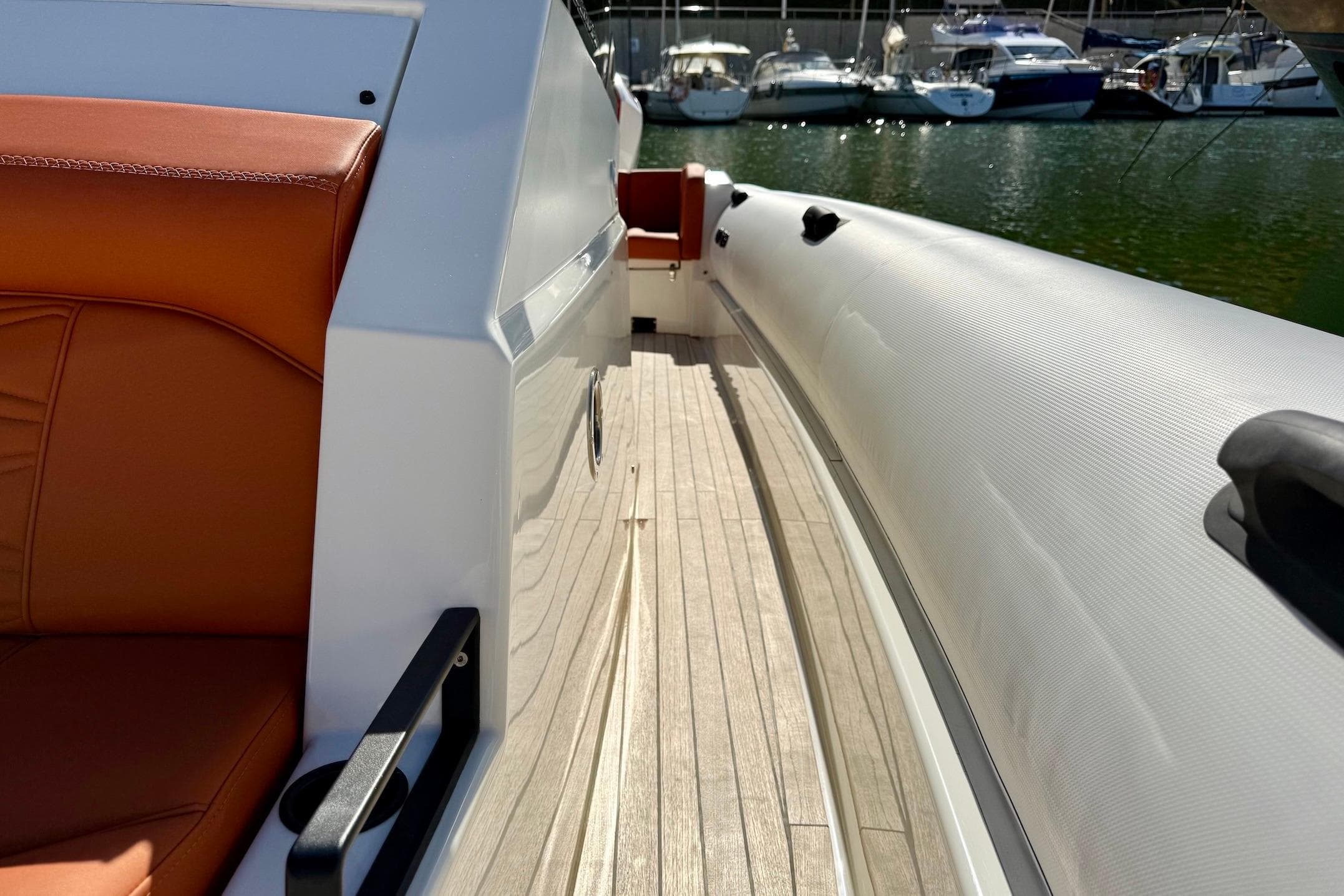 2025 Technohull 38 Grand Sport boat interior with orange seating and sleek design.
