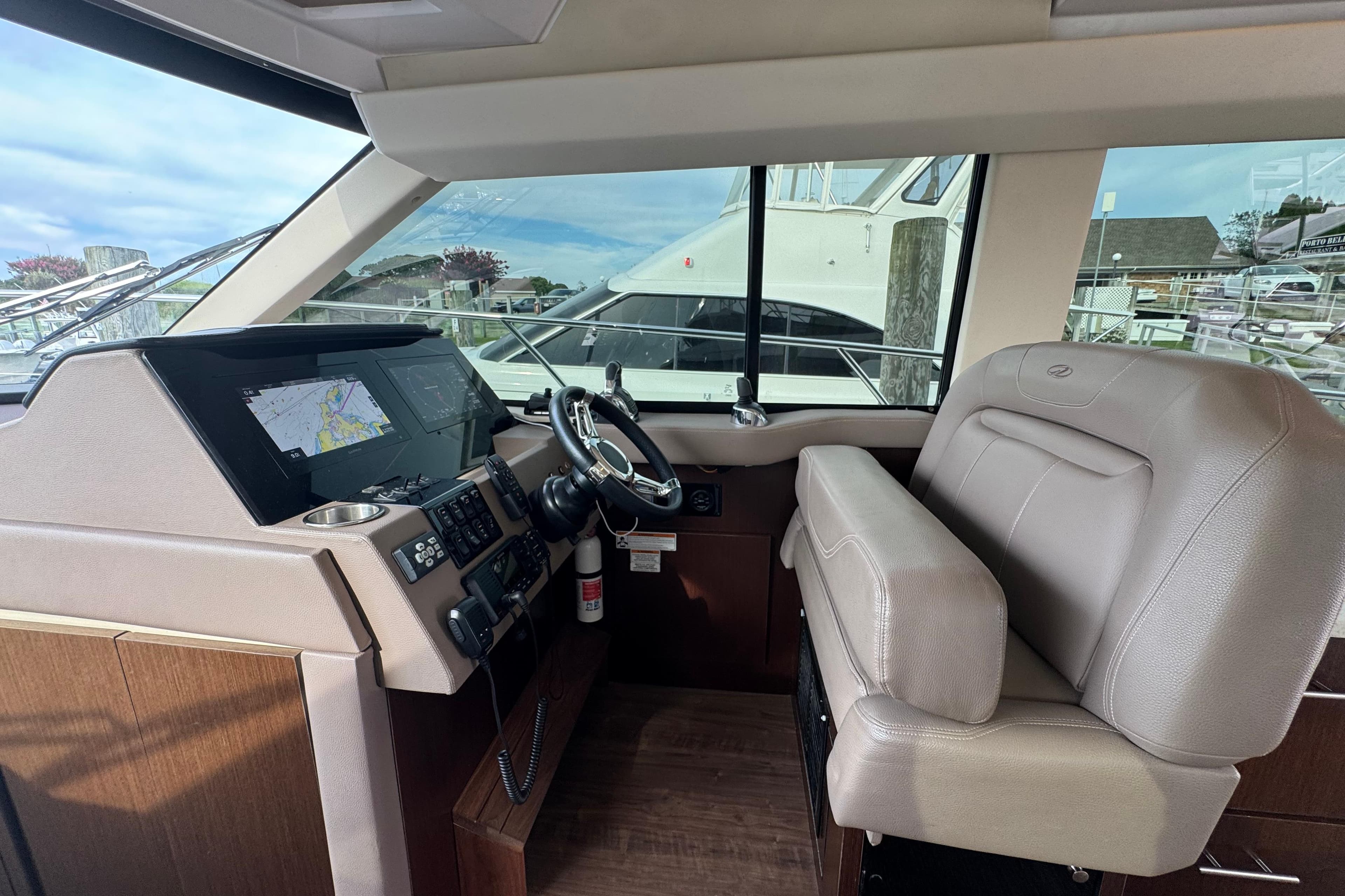 2017 Regal 42 Fly yacht helm with modern navigation system and leather seating.
