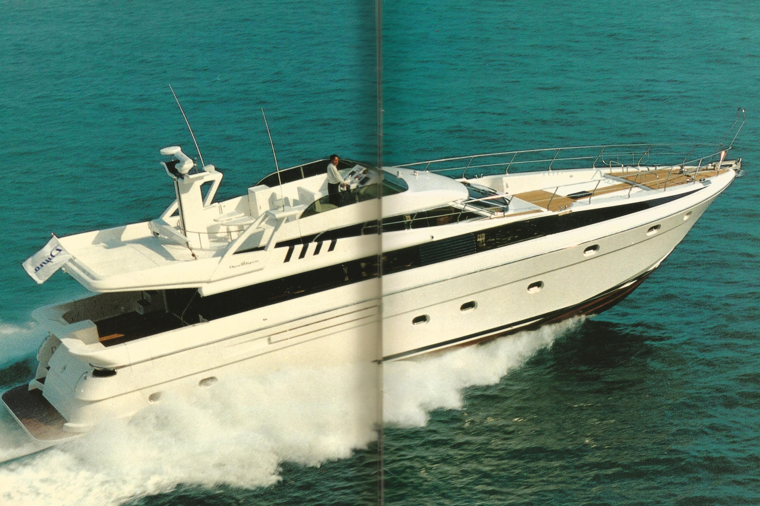Luxury Dyna Laguna yacht cruising on open sea, showcasing sleek design and elegance.