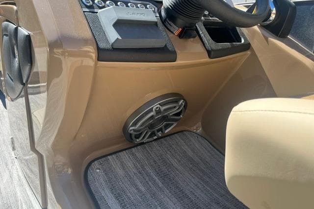 2026 Godfrey Monaco 235 SB boat dashboard with speaker and controls.
