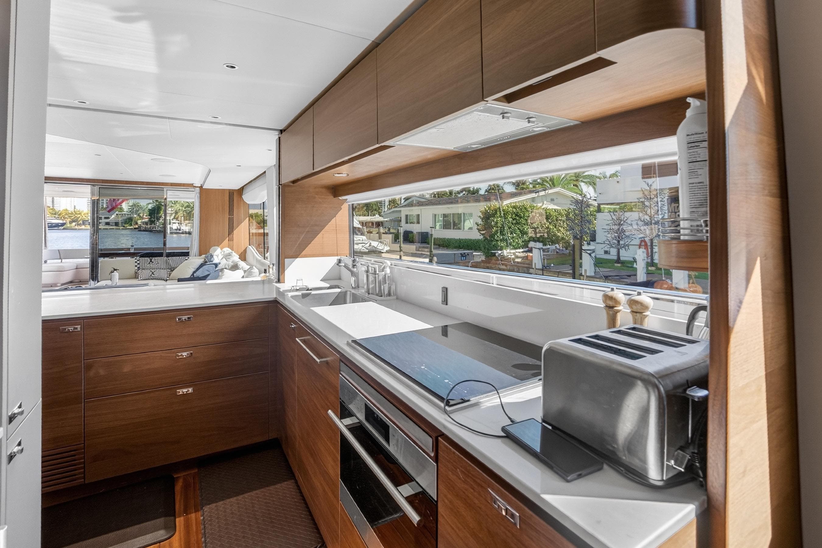 Luxurious kitchen interior of 2022 Princess Y85 yacht with modern appliances and sleek design.