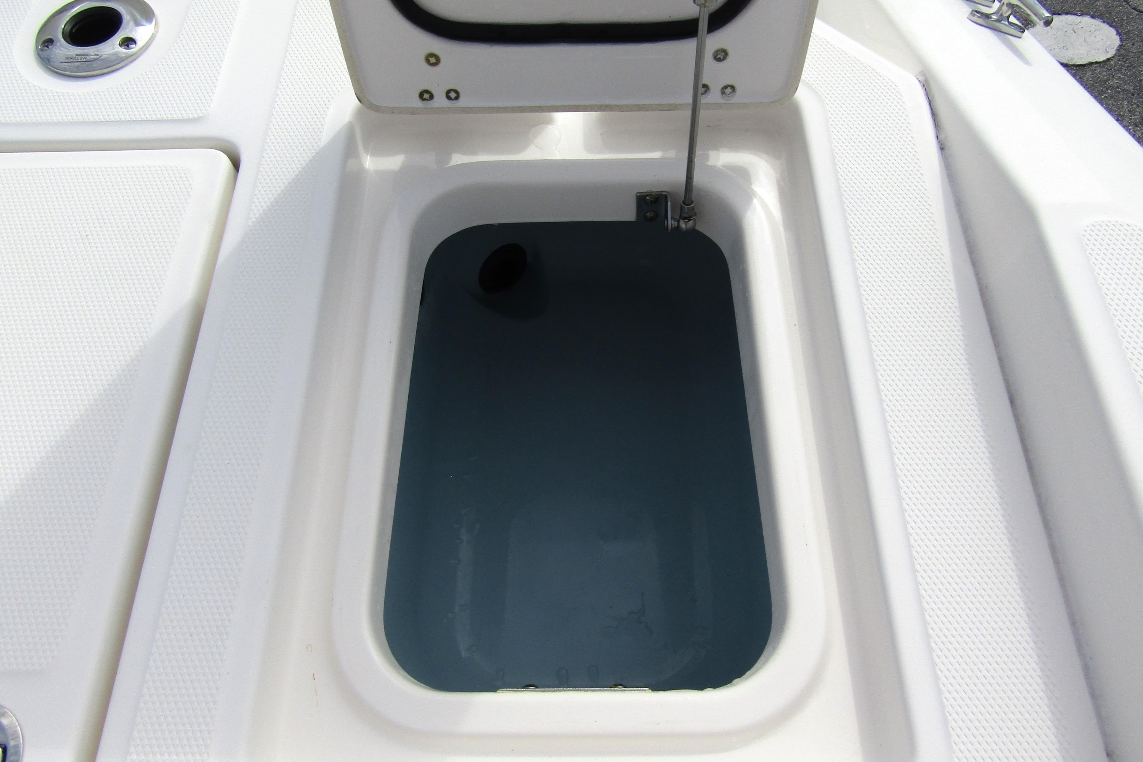 Open storage compartment on 2023 Boston Whaler 280 Dauntless boat.