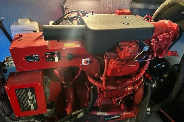 Red engine of a 2001 Sea Ray 380 Sundancer boat, detailed view.