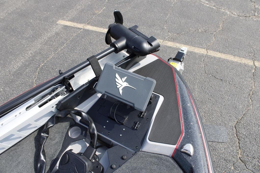 2026 Skeeter ZXE21 boat dashboard with steering wheel and mounted device.