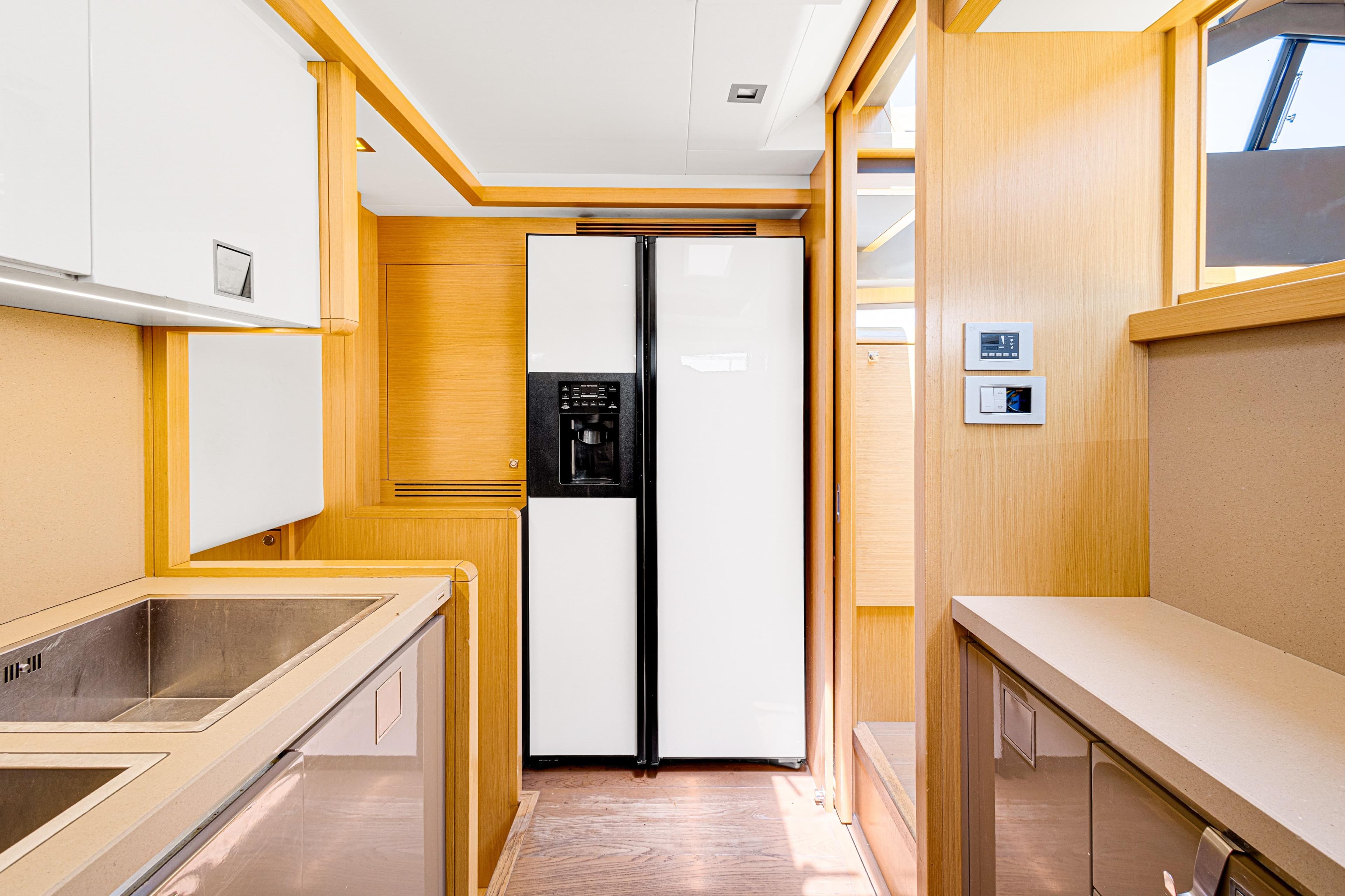 Modern kitchen interior of 2013 Ferretti Yachts 800, featuring sleek cabinetry and appliances.