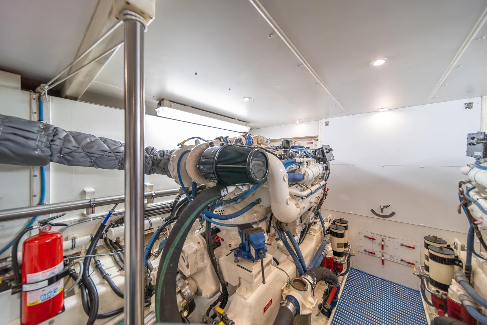 Engine room of 1998 West Bay 58 Sonship Pilothouse MY, showcasing machinery and equipment.