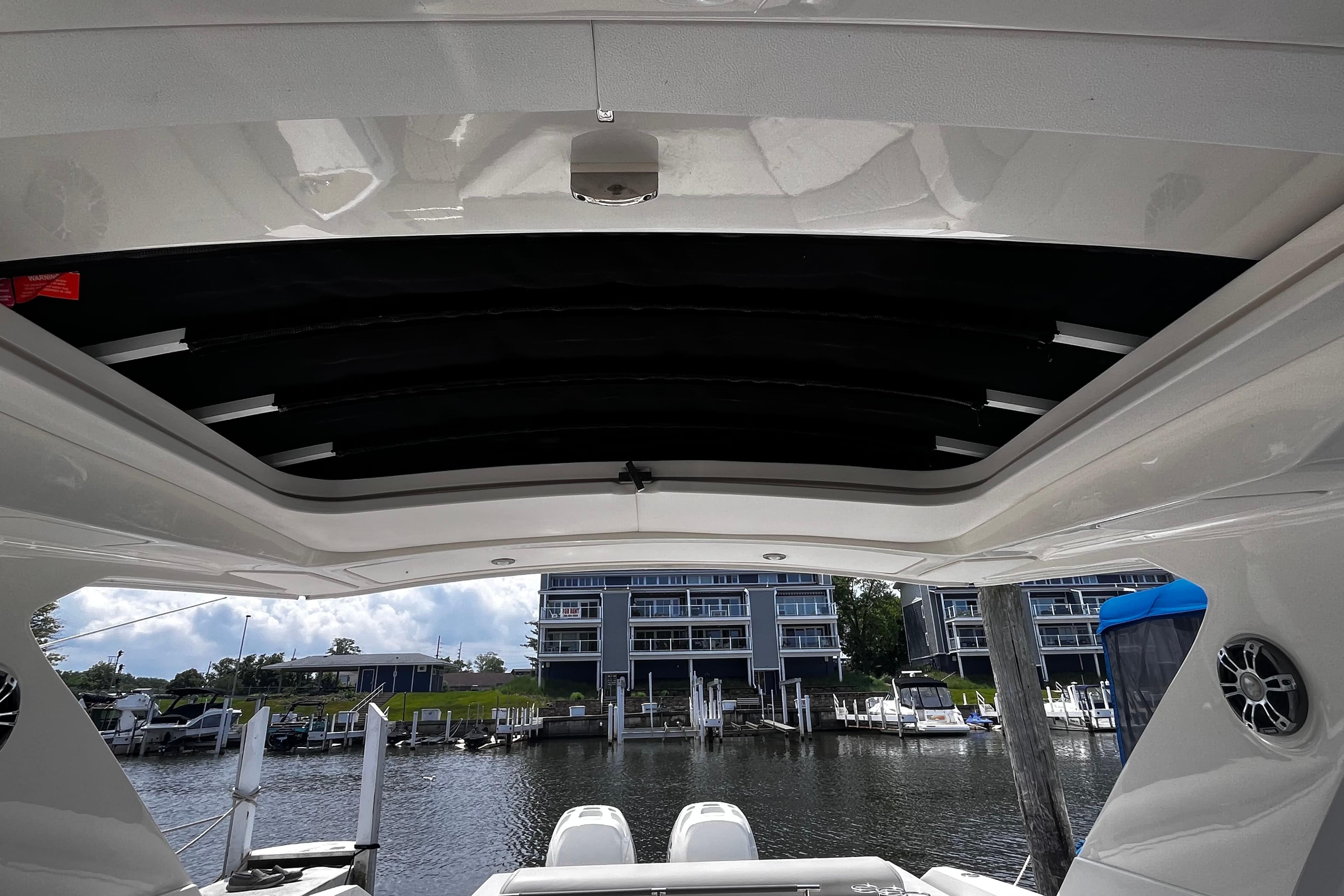 2022 Sea Ray SLX 310 Outboard boat interior with marina view.