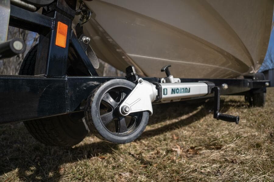 Trailer wheel of 2017 Correct Craft Super Air Nautique GS on grass.