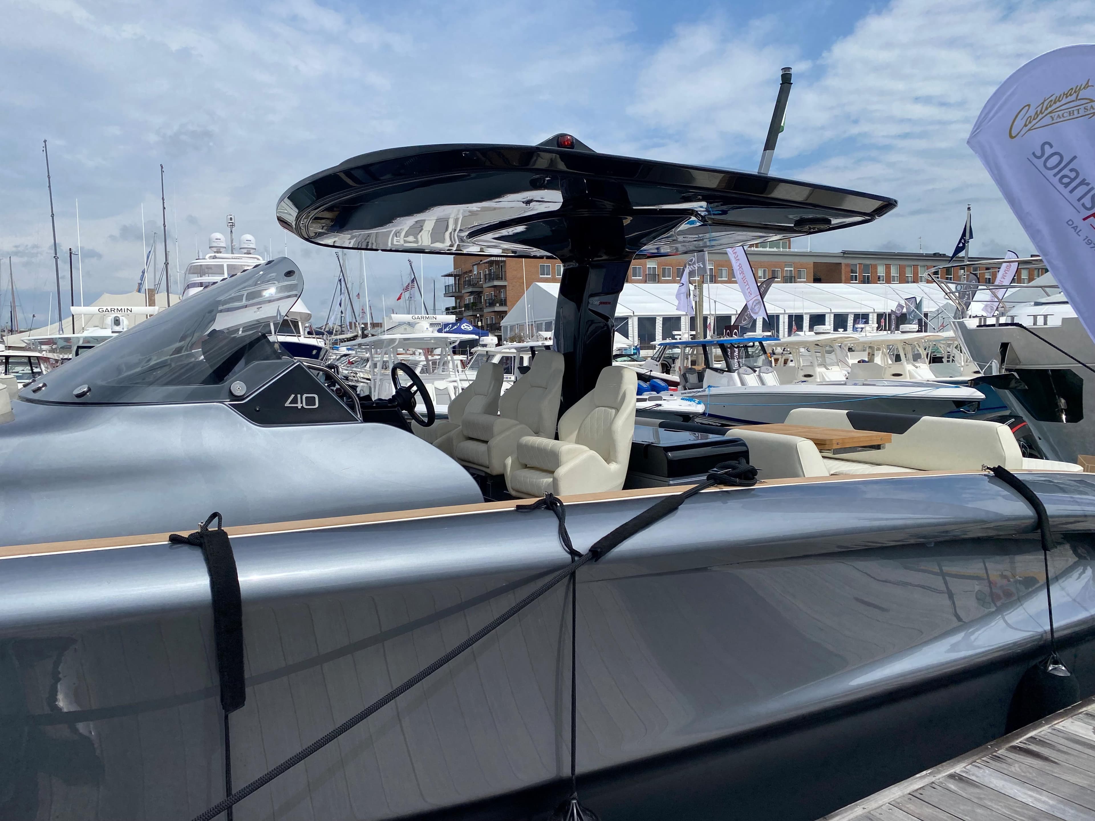 2024 Solaris Power 40F Open yacht docked at marina under blue sky.