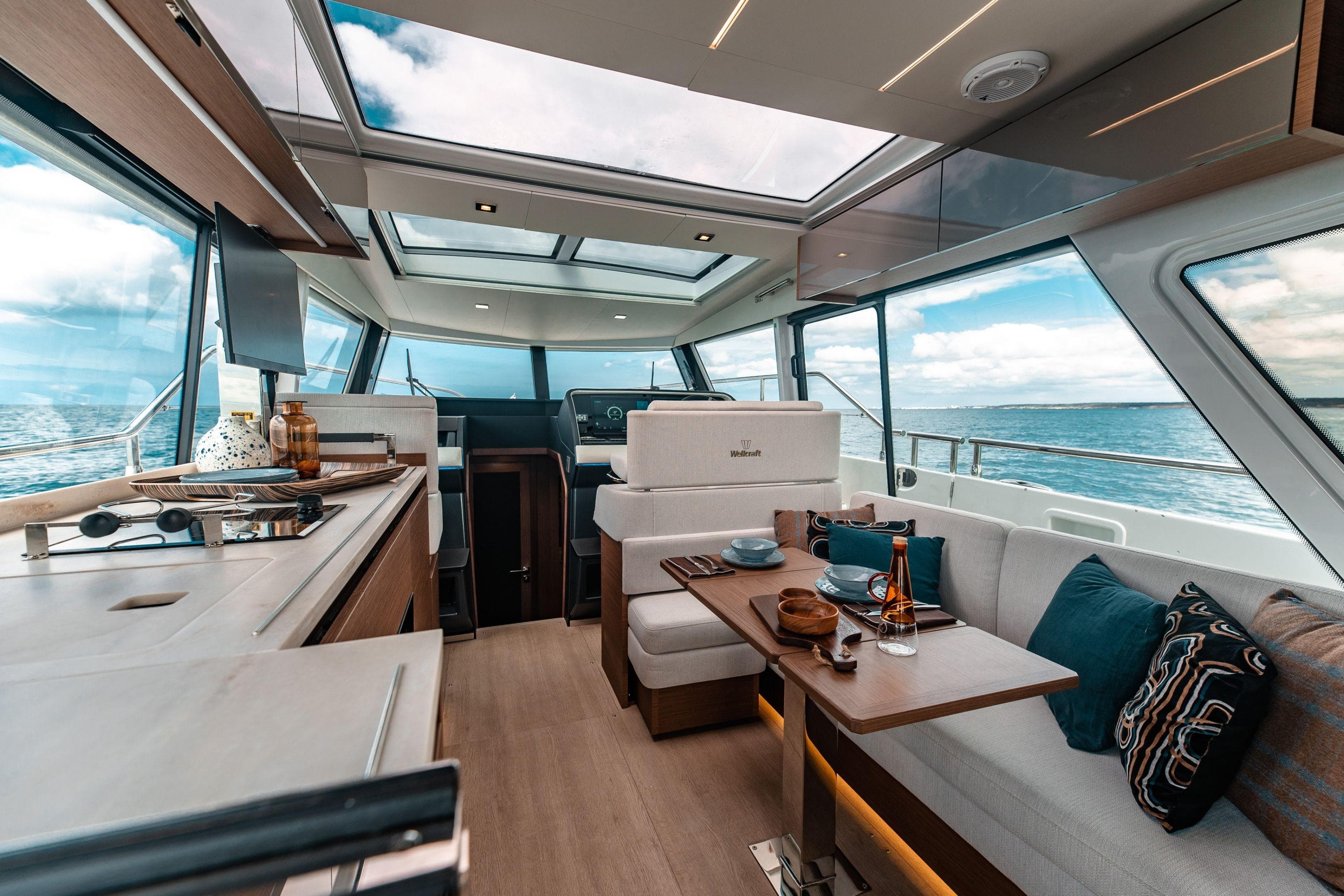 Luxurious interior of 2026 Wellcraft 44 Explorer yacht with panoramic ocean views.