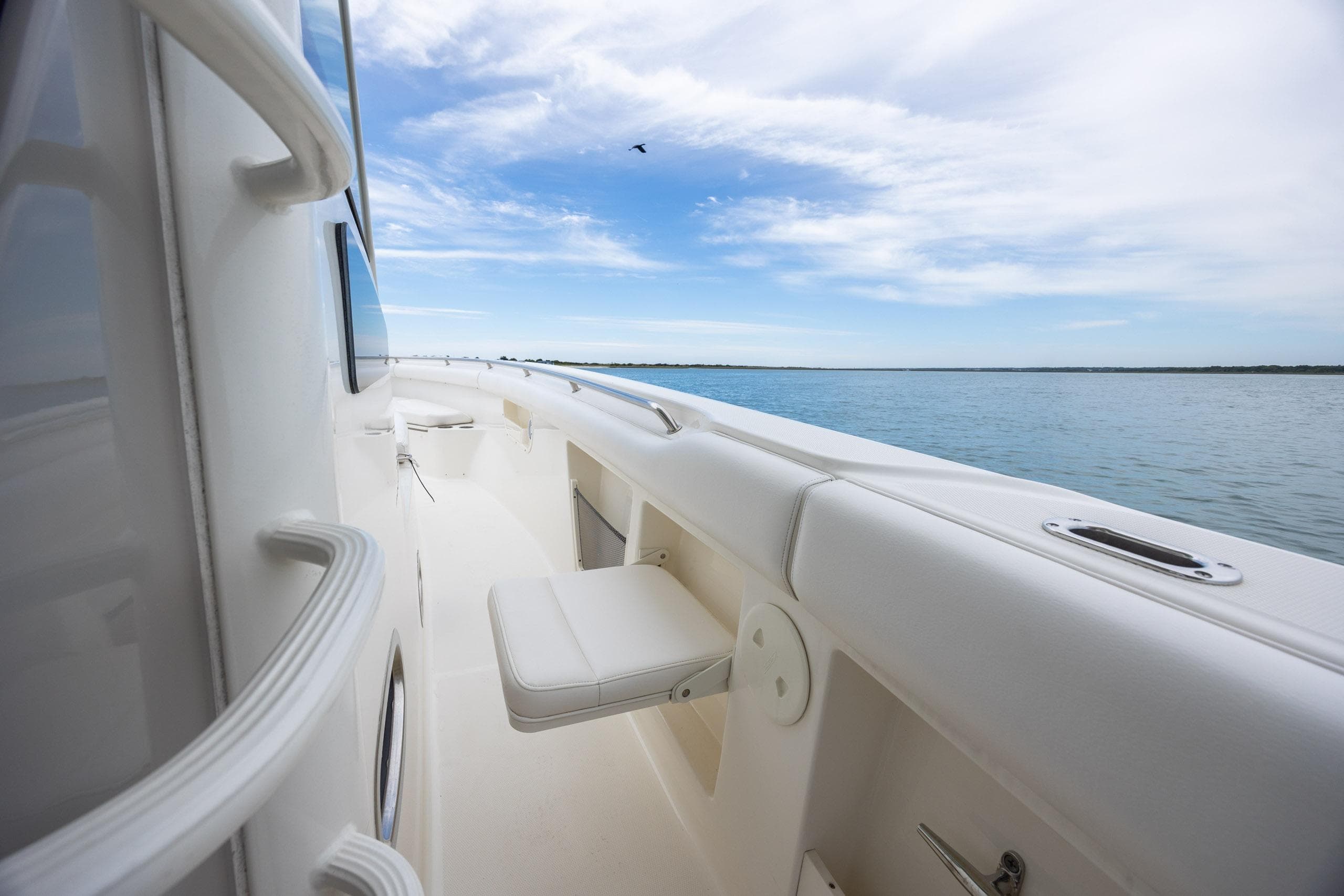 Boston Whaler 370 Outrage 2017 boat deck with ocean view and clear sky.
