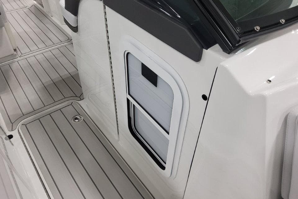 2026 Formula 310 Bowrider deck with sleek, modern design and storage compartment.