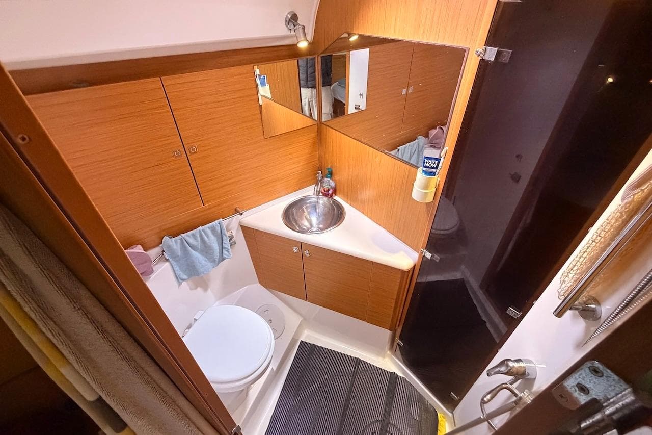 Bathroom interior of 2008 Jeanneau Sun Odyssey 45 DS yacht, featuring sink and toilet.