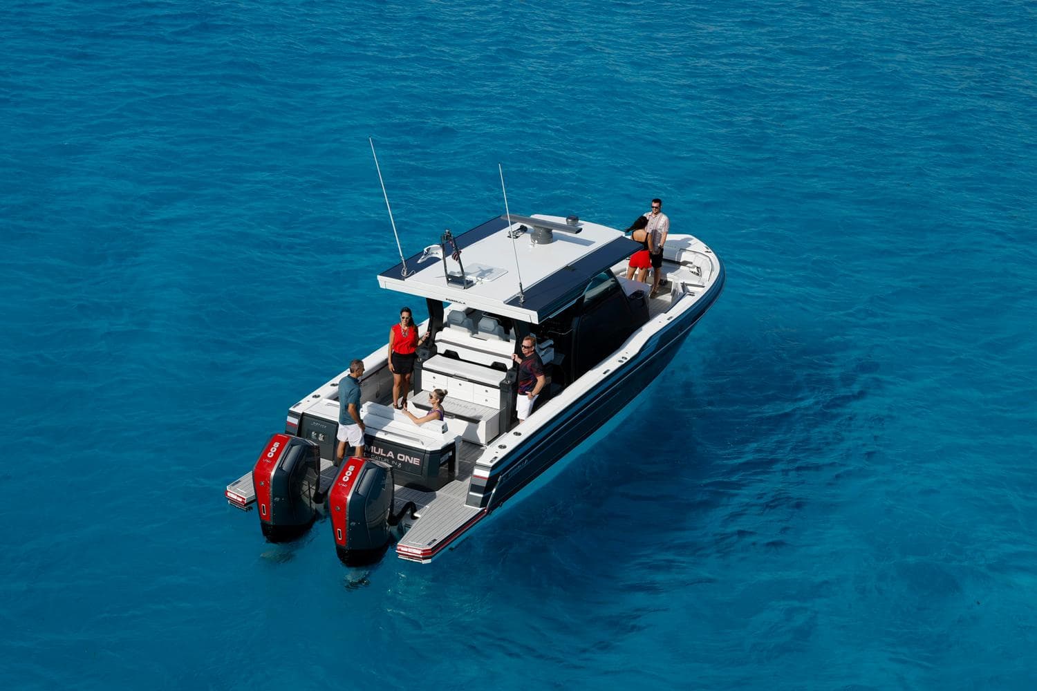 2023 Formula 387 Center Console Sport boat on clear blue water.