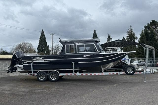 2026 Thunder Jet 26 Alexis Pro XL boat on trailer, parked outdoors.