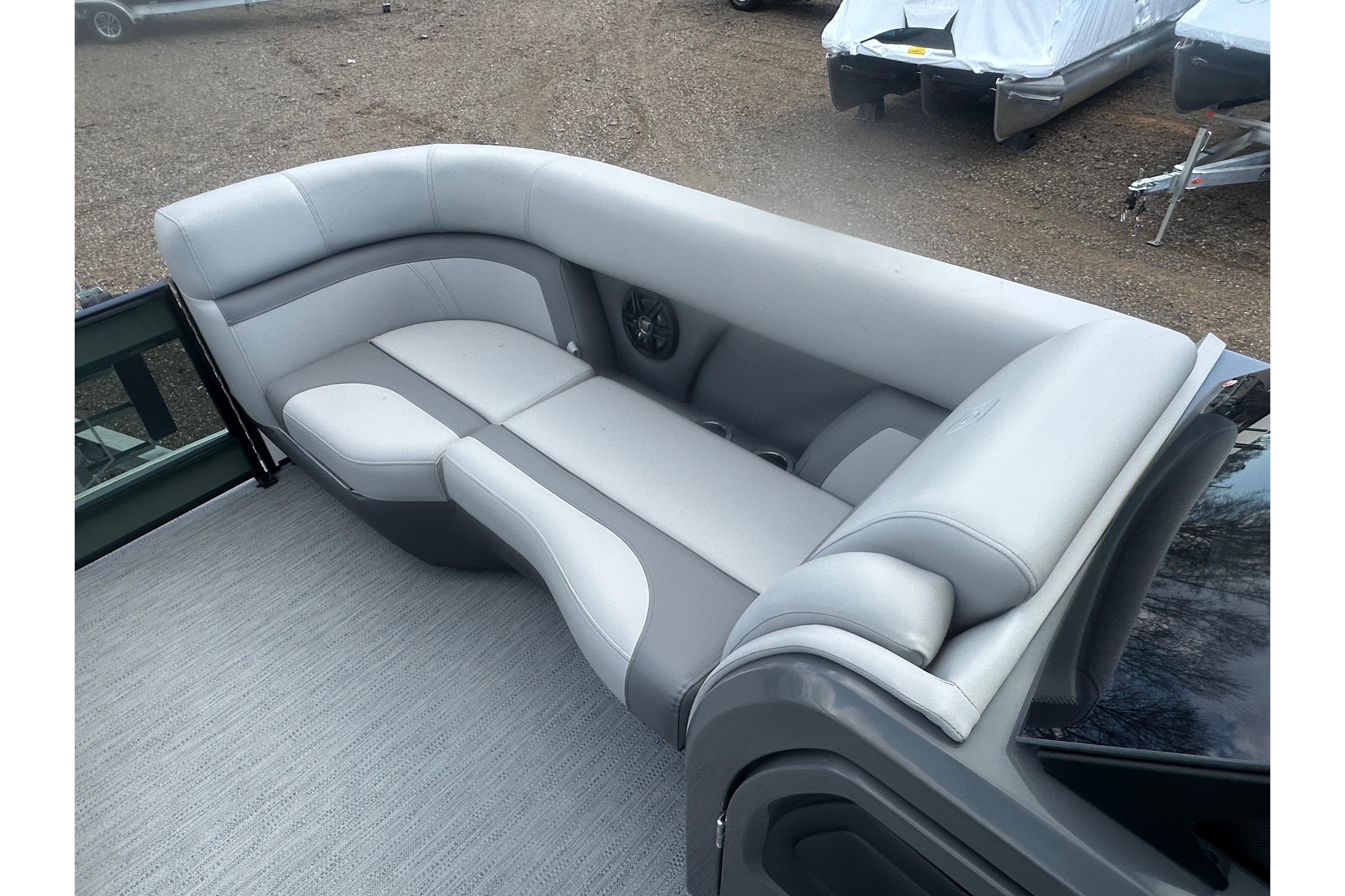 2026 Godfrey Monaco Sun Deck 235 SDC boat interior with gray seating.