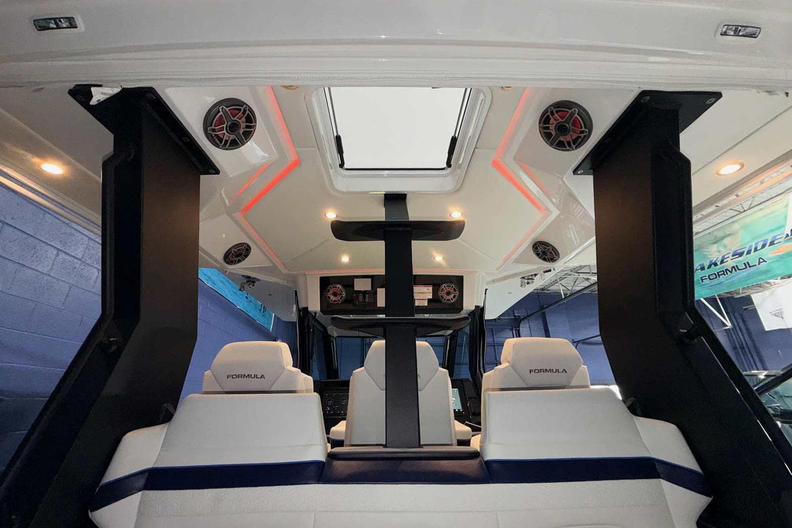 Interior of 2025 Formula 387 Center Console Fish boat with modern seating and speakers.