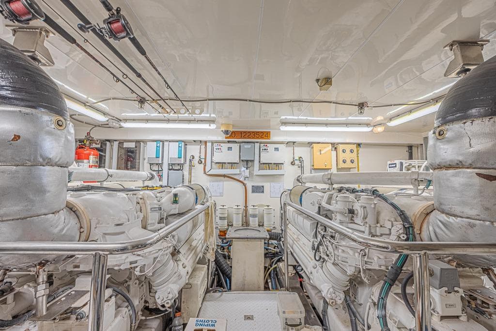 Engine room of 2010 Ocean Alexander 74 Motoryacht, featuring dual engines and control systems.
