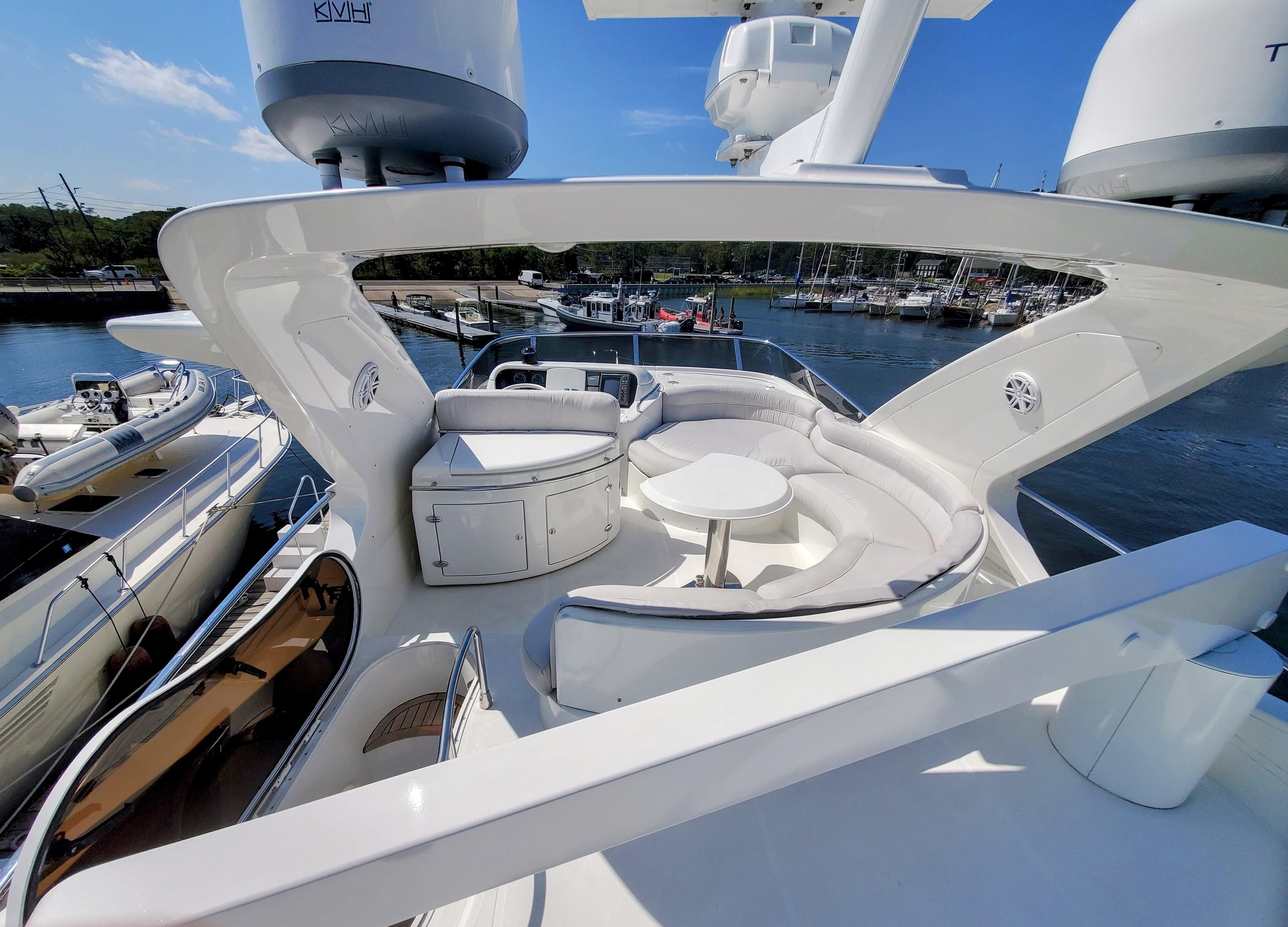 Luxurious 2002 Azimut 55 yacht with spacious deck and elegant seating area.